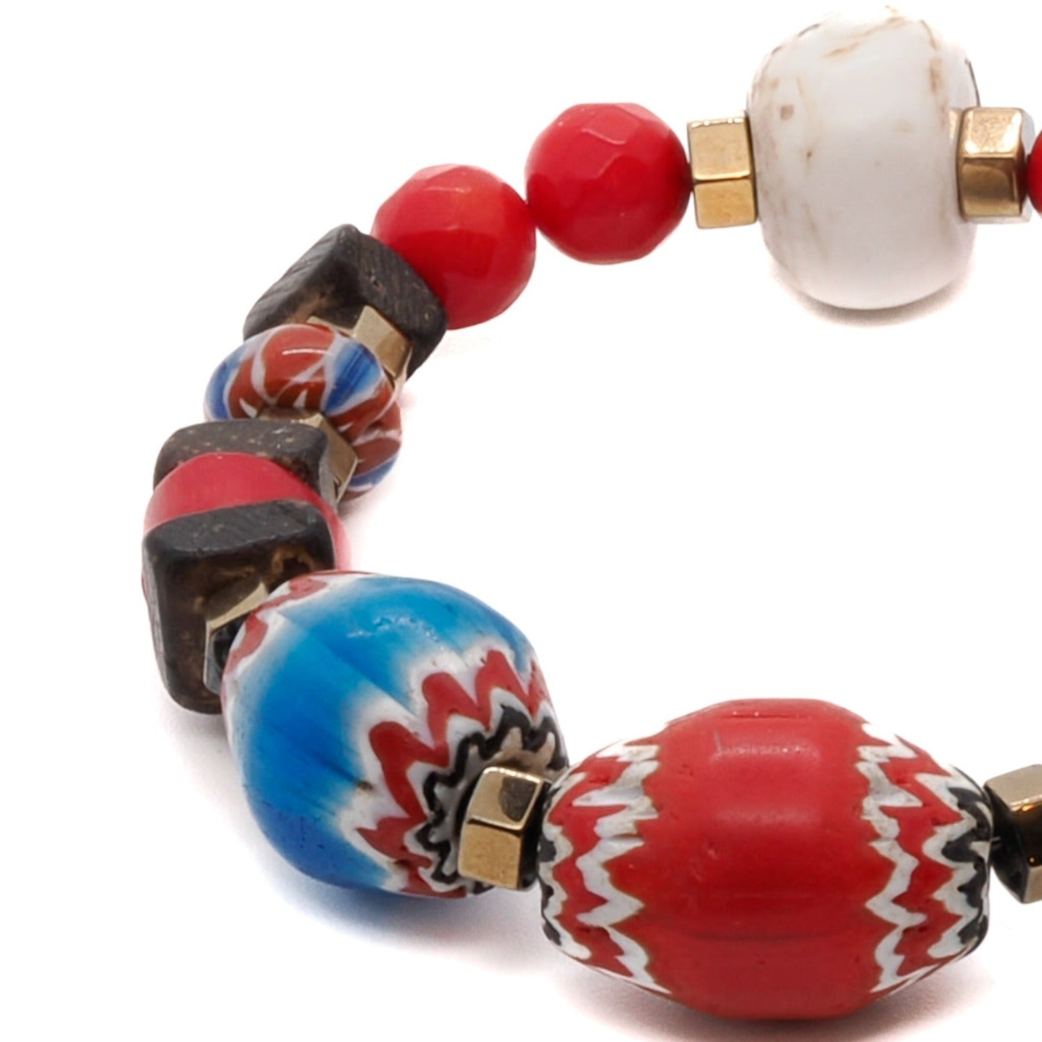 Discover the passion and energy of the Palena Bracelet, a handmade piece of jewelry crafted with red coral stone and gold hematite spacers.