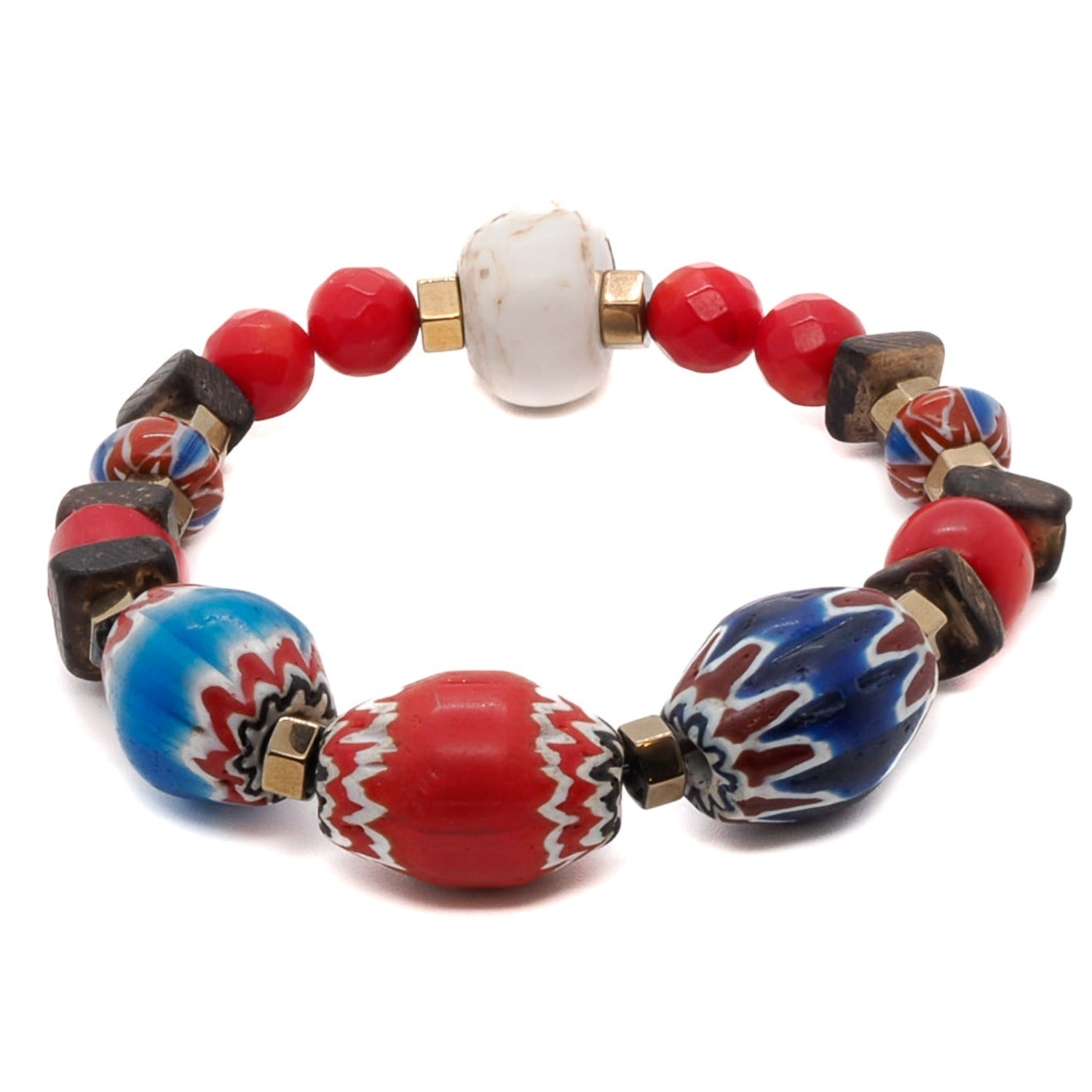 Celebrate your individuality with the Palena Bracelet, a one-of-a-kind piece of handmade jewelry adorned with African beads and red coral stone.