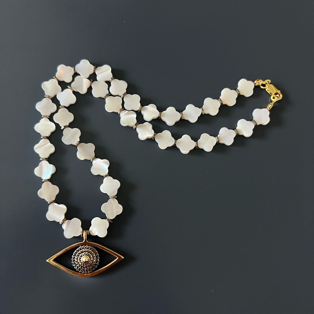 Handcrafted Pearl Clover Evil Eye Necklace for spiritual protection and positive energy.