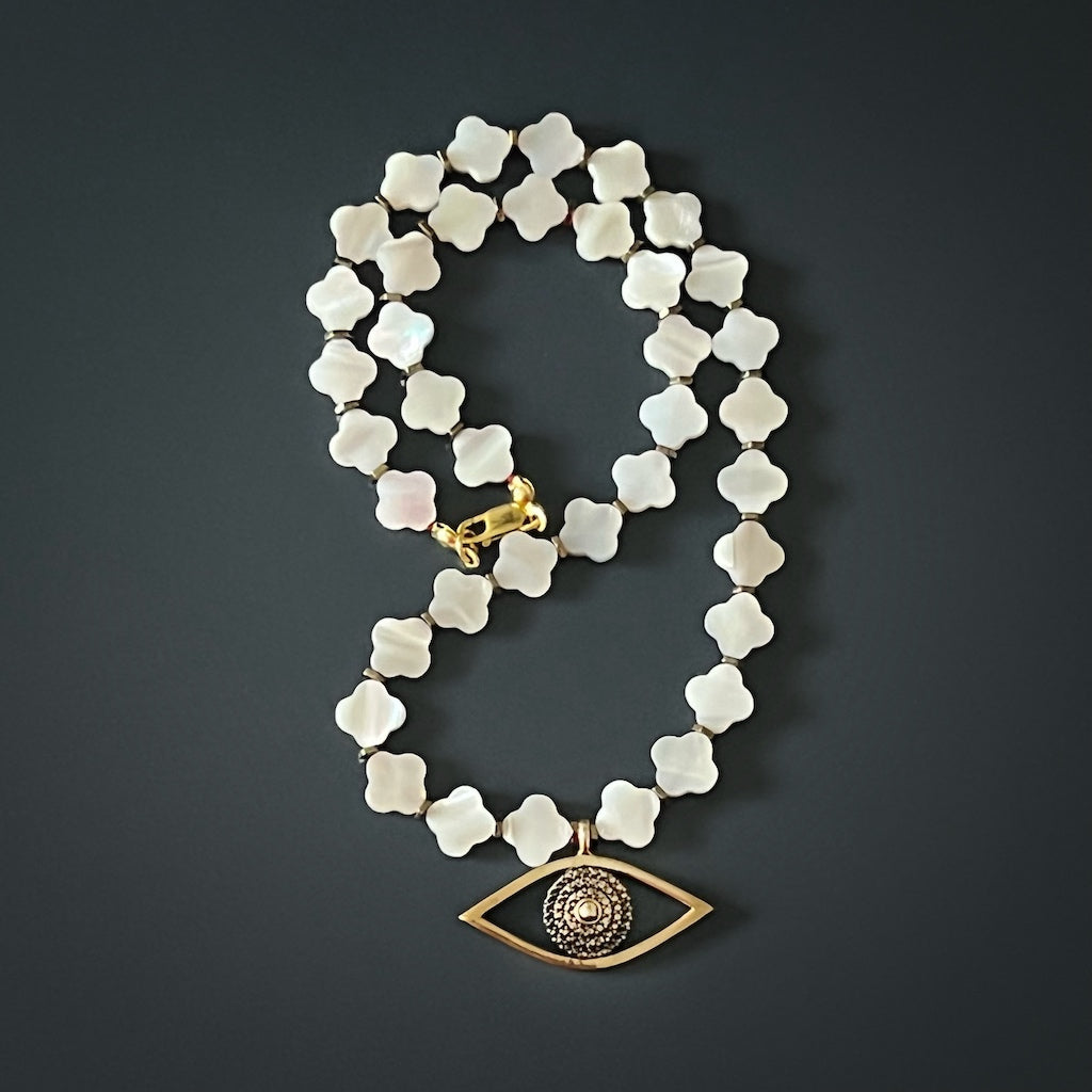 Elegant Handmade Necklace featuring a combination of pearl clover flower beads and Evil Eye charm.