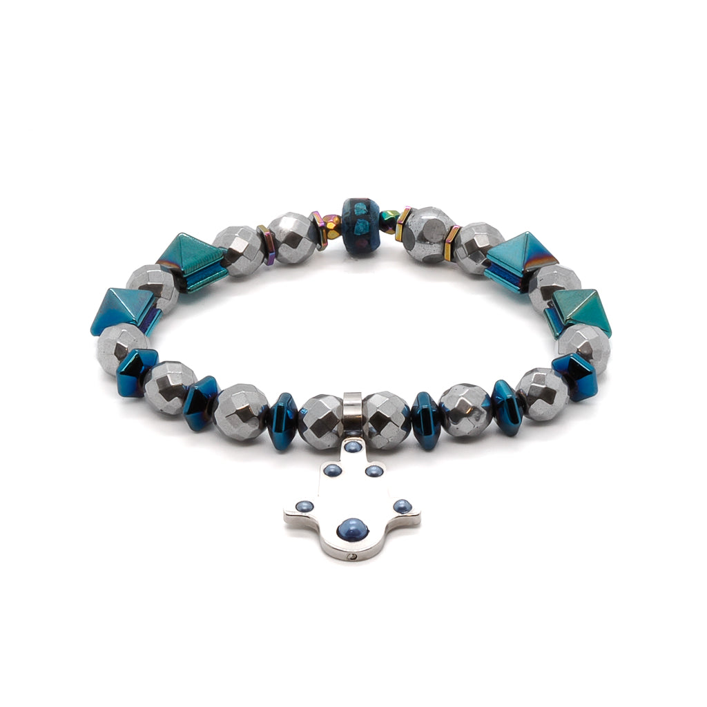 Embrace the positive energy of the Positive Hamsa Bracelet, featuring silver faceted hematite beads, blue hematite pyramid beads, and a stainless steel Hamsa charm.