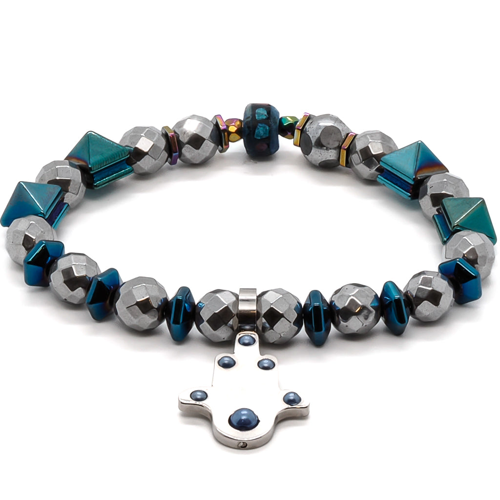The Positive Hamsa Bracelet combines the beauty of silver faceted hematite beads, blue hematite pyramid beads, and the protective energy of the Hamsa charm.