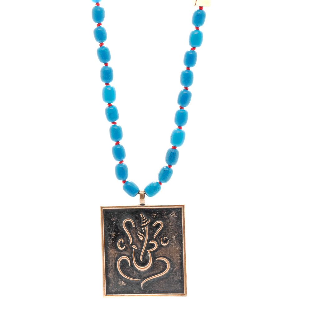 Positive Life Turquoise Necklace with Ganesha and Buddha pendant, a reminder of positivity and wisdom.