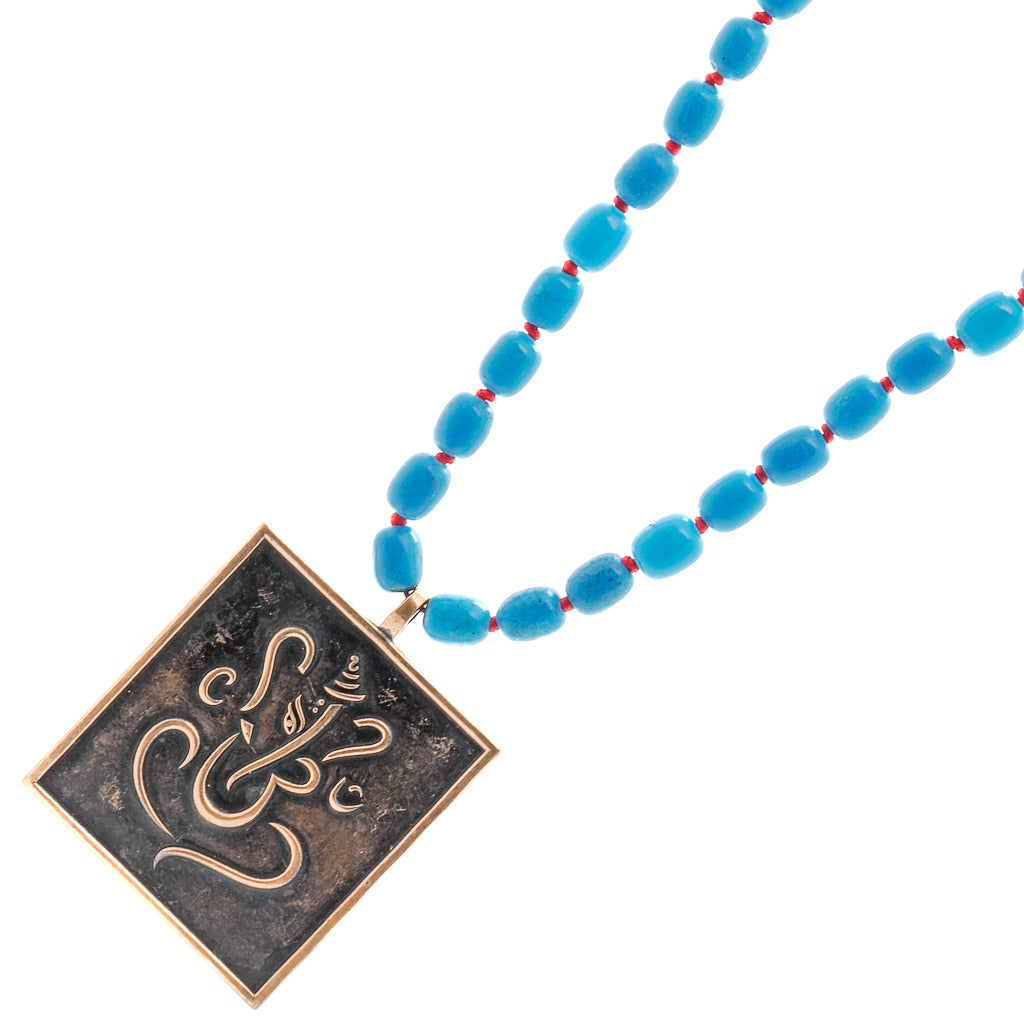 Positive Life Necklace, a beautiful combination of turquoise and meaningful spiritual symbols.