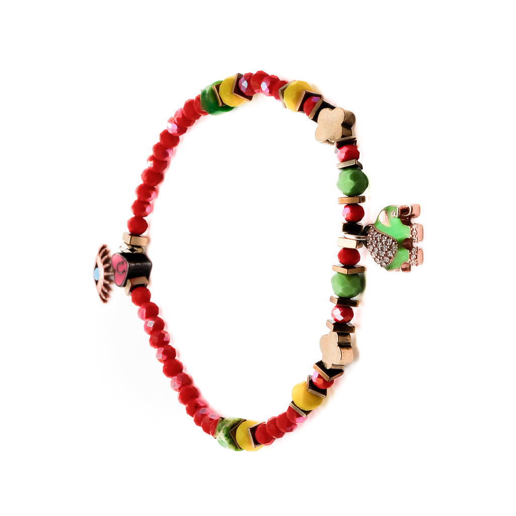 The Powerful Symbol Anklet brings together the energies of red crystal beads, green jasper beads, a gold color hematite floral bead, and silver charms symbolizing the evil eye, elephant, and lucky horse shoe, creating a meaningful and stylish accessory.