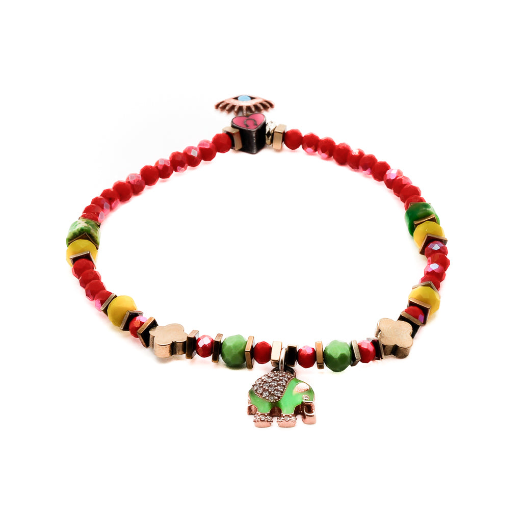 Embrace the positive energy of the Powerful Symbol Anklet, featuring red crystal beads, green jasper beads, a gold color hematite floral bead, and symbolic silver charms of the evil eye, elephant, and lucky horse shoe.