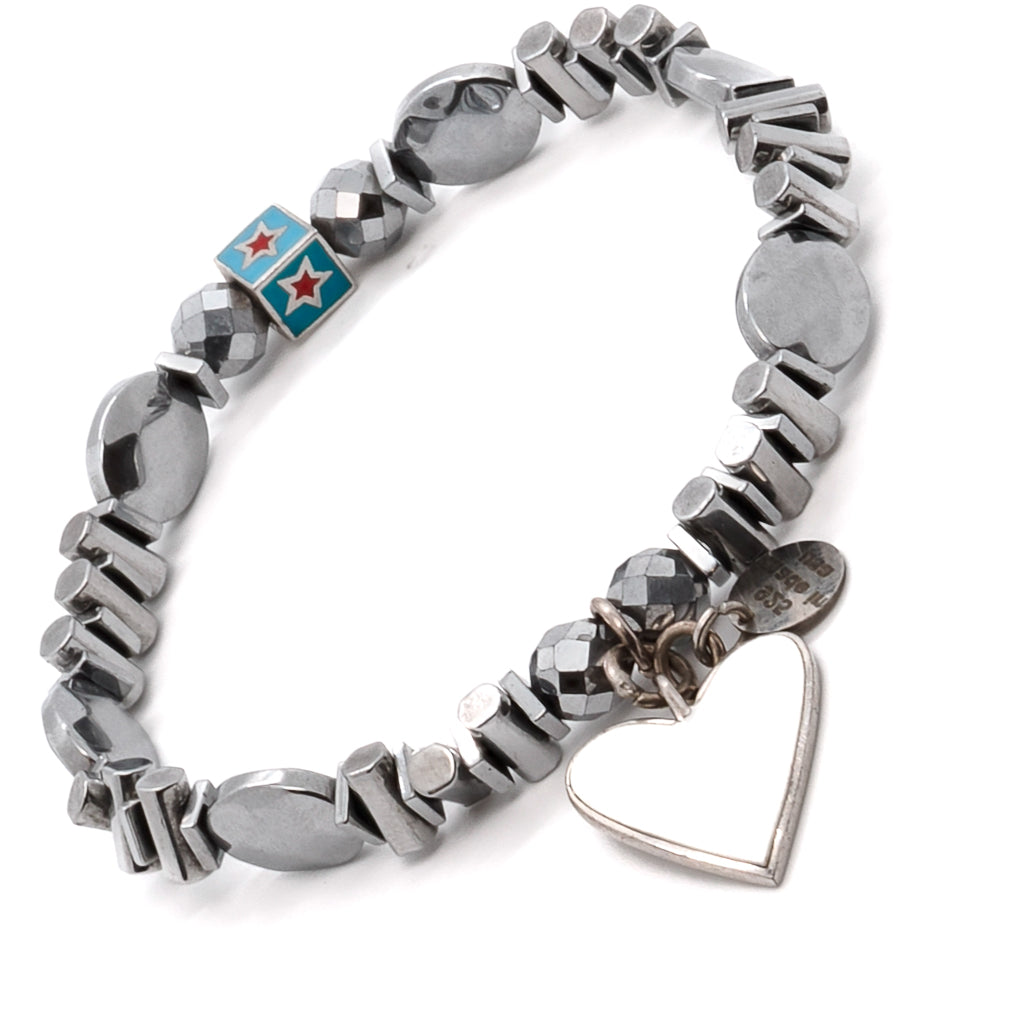 Discover the modern aesthetic of the Pure White Heart Bracelet, highlighting its geometric silver-colored hematite beads and sterling silver charms.