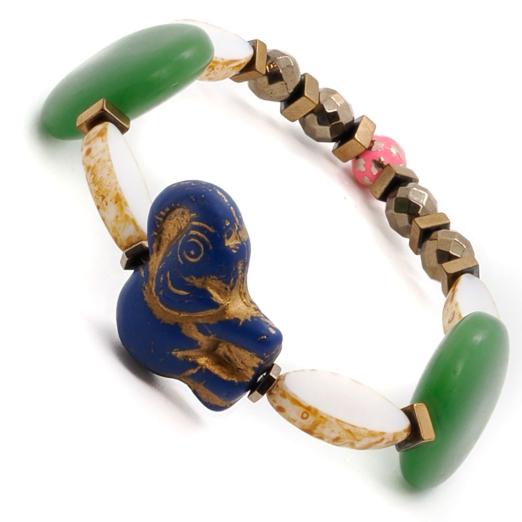 Experience the playfulness of the Purple Elephant Bracelet, featuring a purple and gold African ceramic elephant bead as its centerpiece.