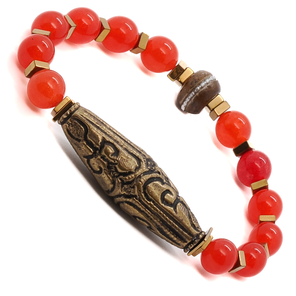The Red Carnelian Vintage Bracelet combines the elegance of red carnelian stone beads with the artistry of a Nepal handmade brass charm, creating a unique and meaningful piece.