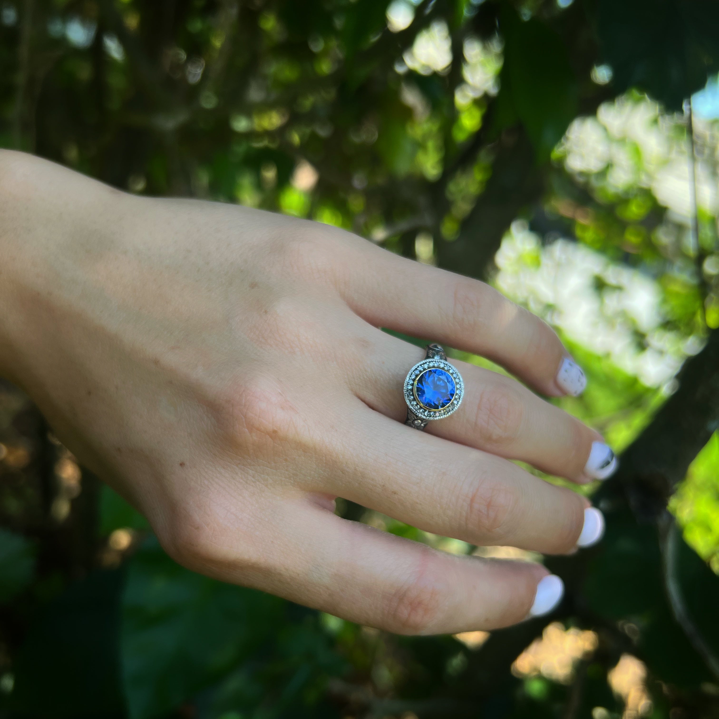 Attract Abundance - Model Wearing Sapphire Ring with grace.