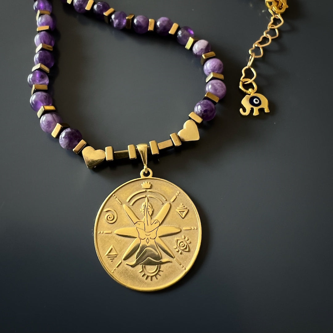 Stylish Protection - The Gold Hematite Stones and Symbolic Pendant on the Amethyst Choker Necklace.