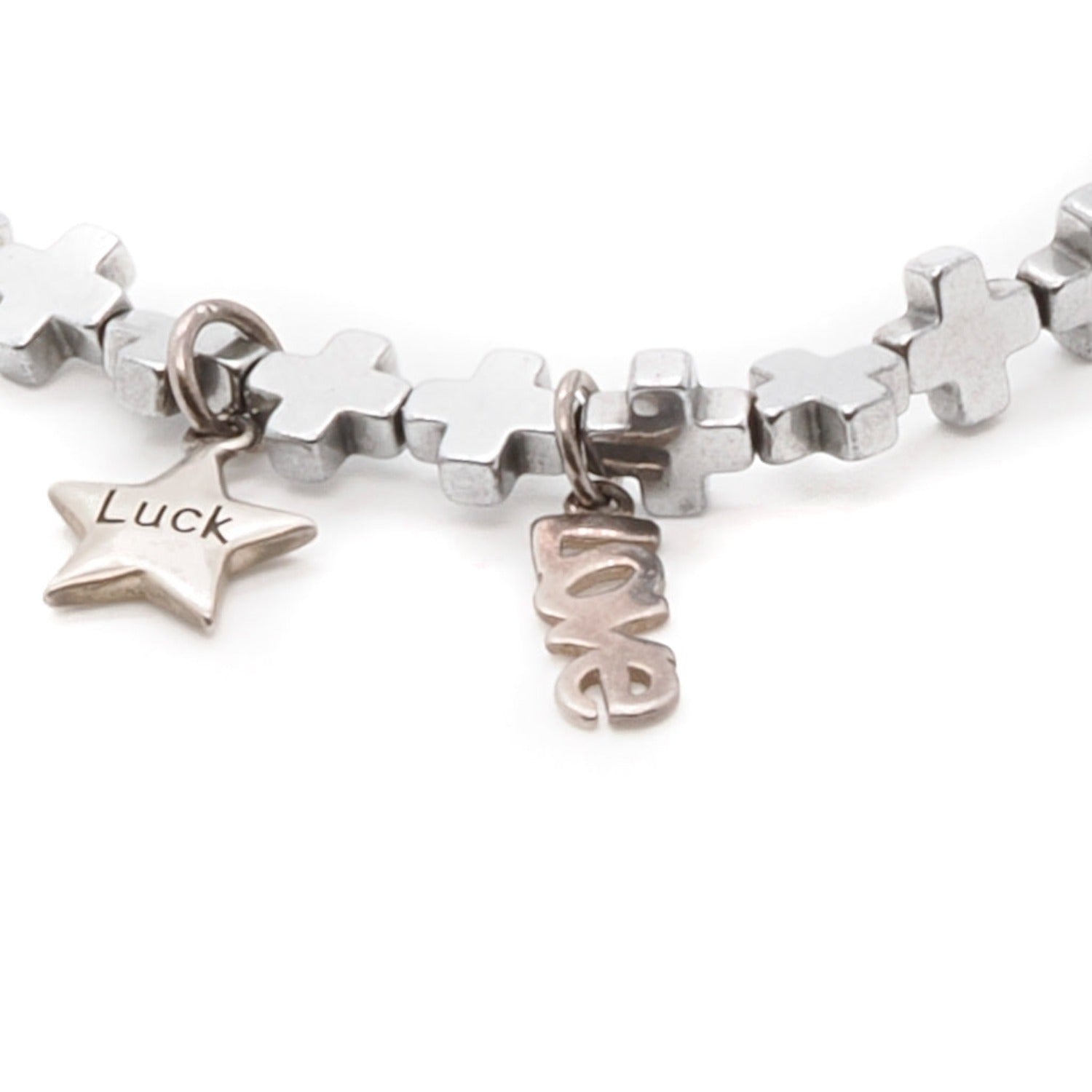 Explore the symbolism of the Silver Color Lucky Charms Bracelet, showcasing its sterling silver lucky charms and red enamel horseshoe symbol bead.