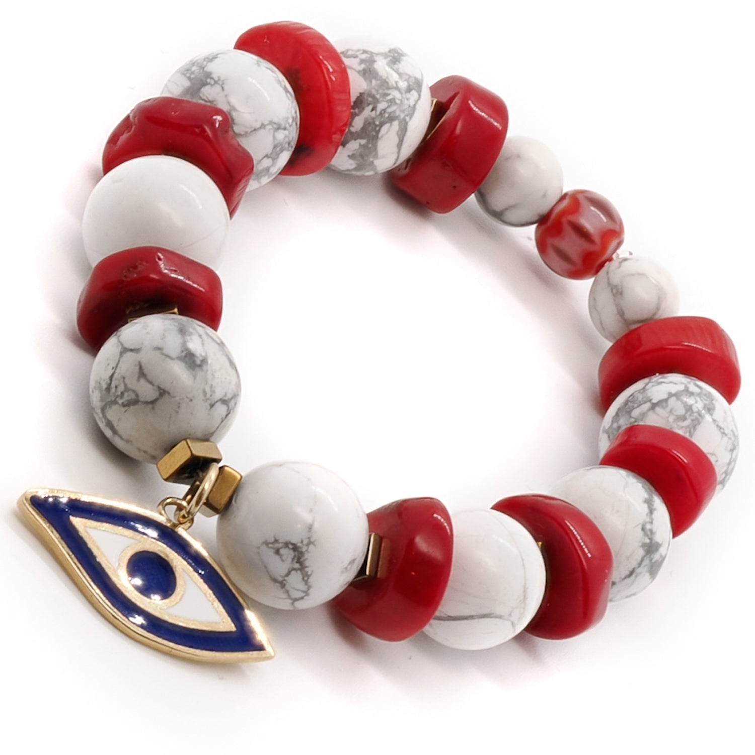 The Spiritual Beads Evil Eye Bracelet combines the beauty of white howlite, red coral, and a sterling silver evil eye charm.