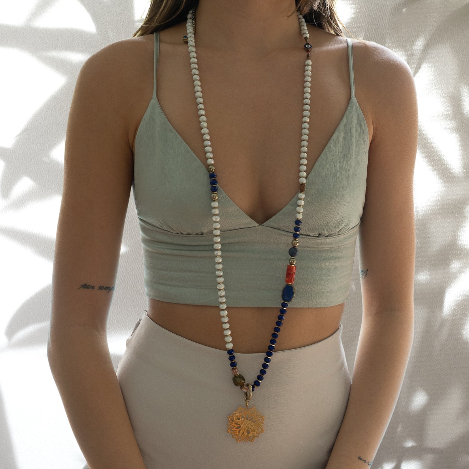 The model showcases the beauty and spirituality of the Spiritual Elephant Necklace, radiating positive energy and charm.