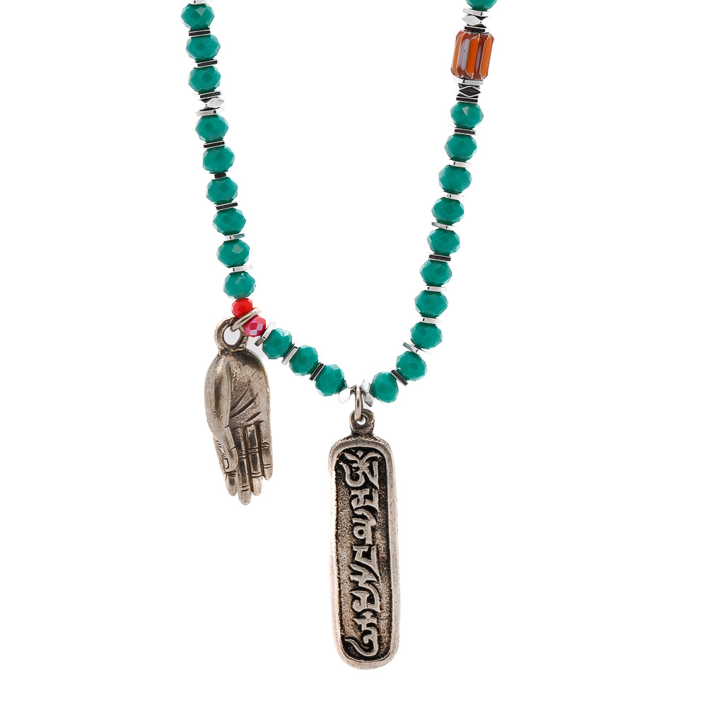 Spiritual Om Yoga Necklace featuring green crystal beads and a Tibetan silver Om Mani Padme Hum pendant.