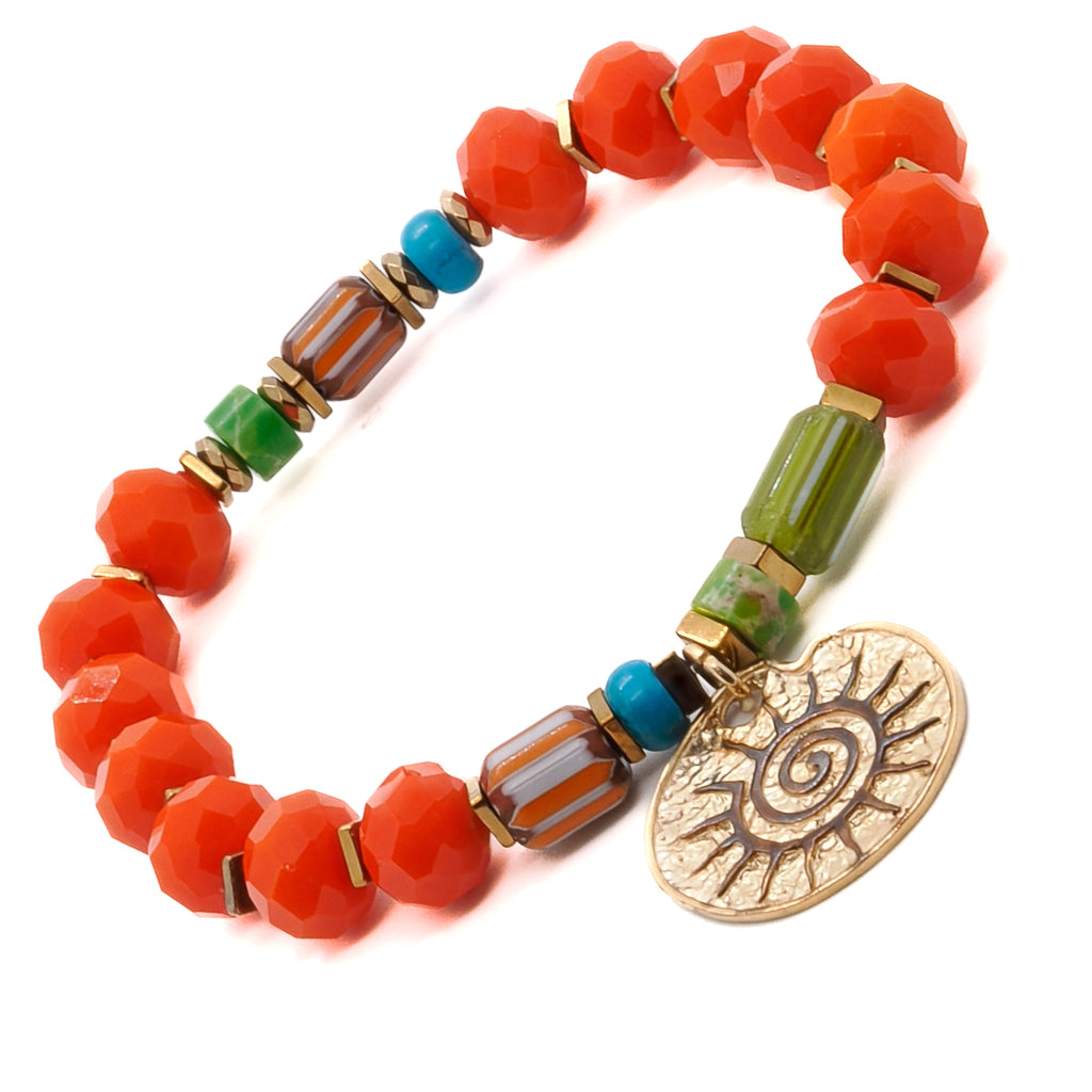 Discover the beauty and symbolism of the Spiritual Sun Bracelet, showcasing orange crystal beads, gold hematite spacers, and a sun charm.