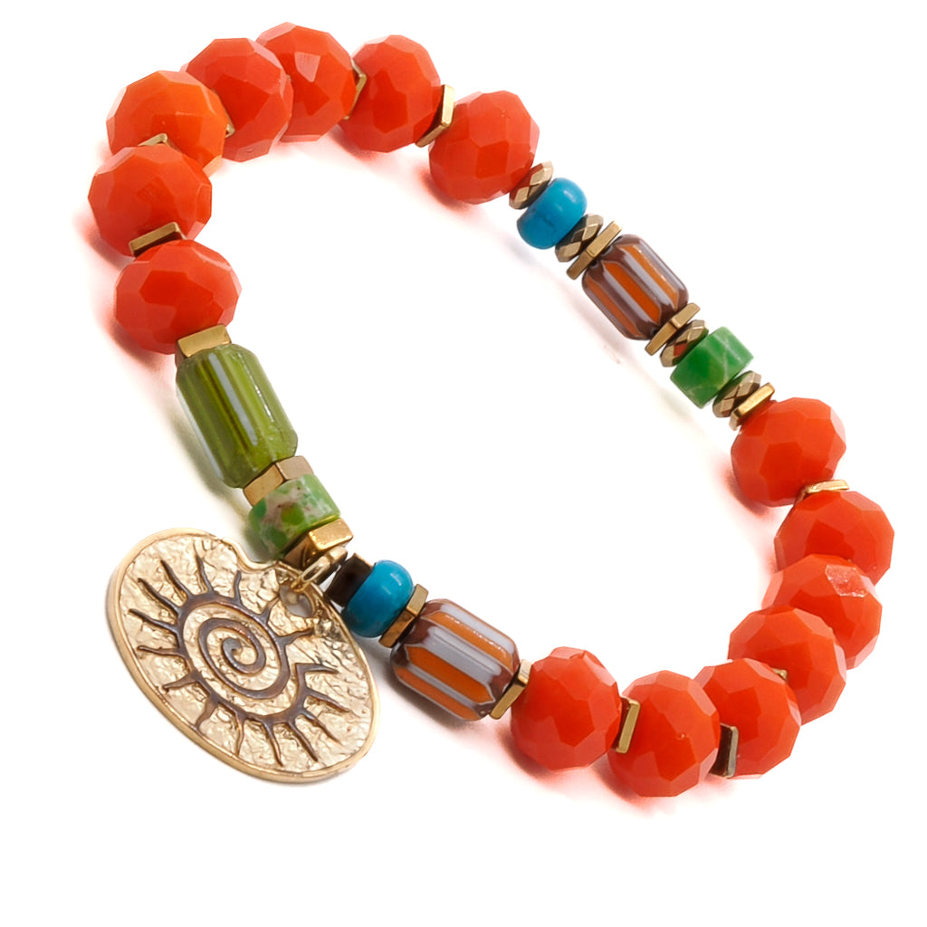 Embrace the vibrant energy of the Spiritual Sun Bracelet, adorned with orange crystal beads, colorful African beads, and a gold-plated sterling silver sun charm.