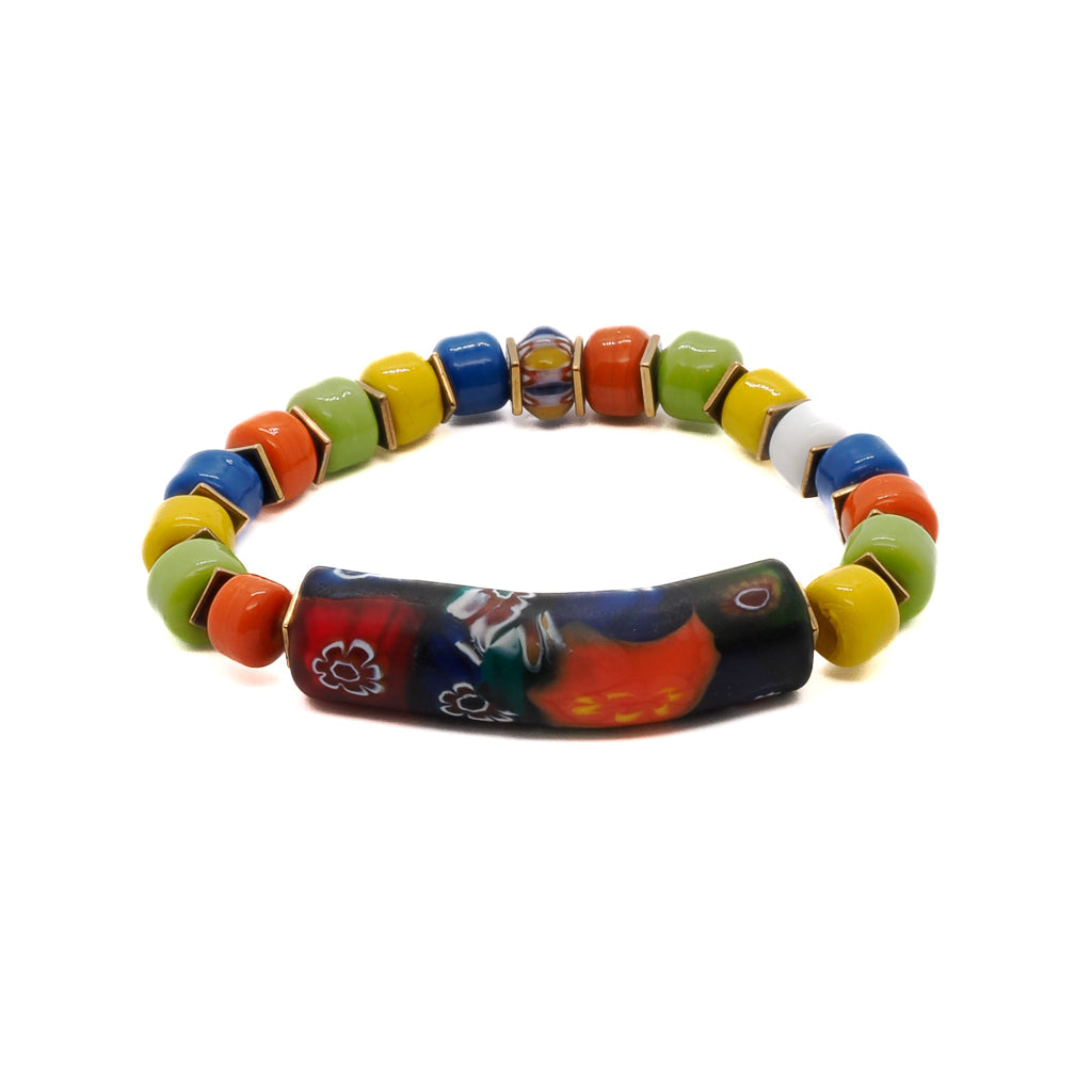 Embrace the vibrant energy of spring with the Spring Vibes Bracelet, featuring colorful Indian beads, gold hematite spacers, and a unique handmade glass tube bead with floral patterns.