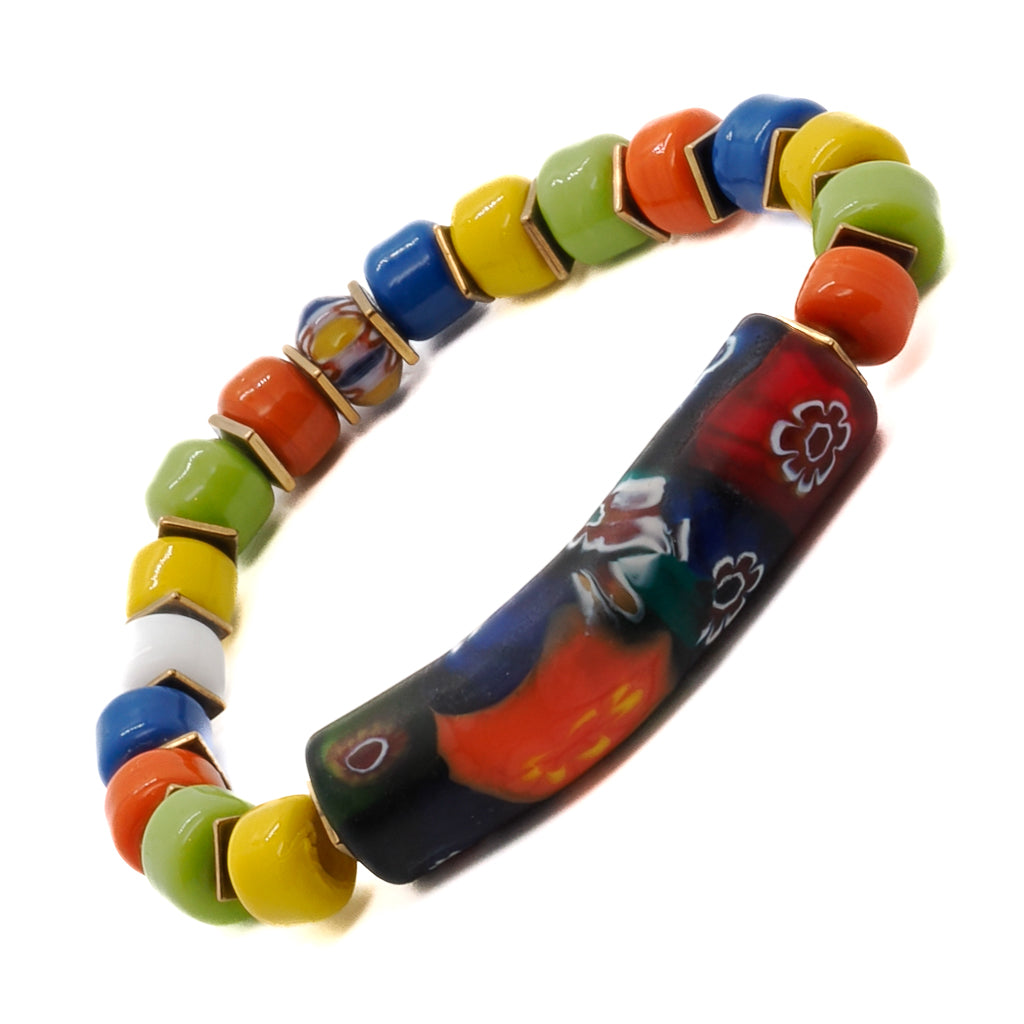 Elevate your style with the Spring Vibes Bracelet, adorned with colorful Indian beads, gold hematite spacers, a unique glass tube bead, and a vibrant African bead.
