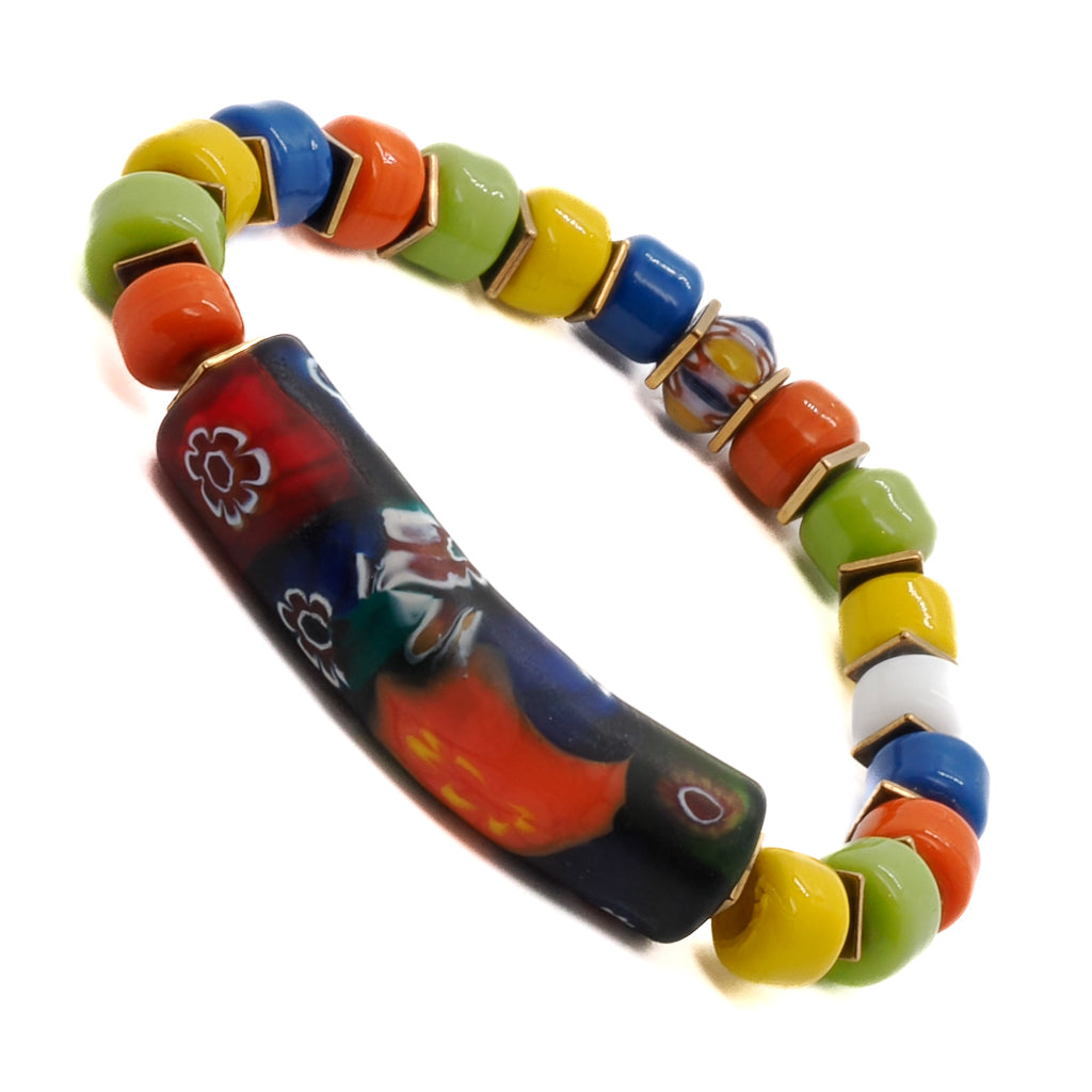Experience the essence of the season with the Spring Vibes Bracelet, showcasing a combination of colorful Indian beads, gold hematite spacers, a colorful African bead, and a handmade glass tube bead with floral patterns.