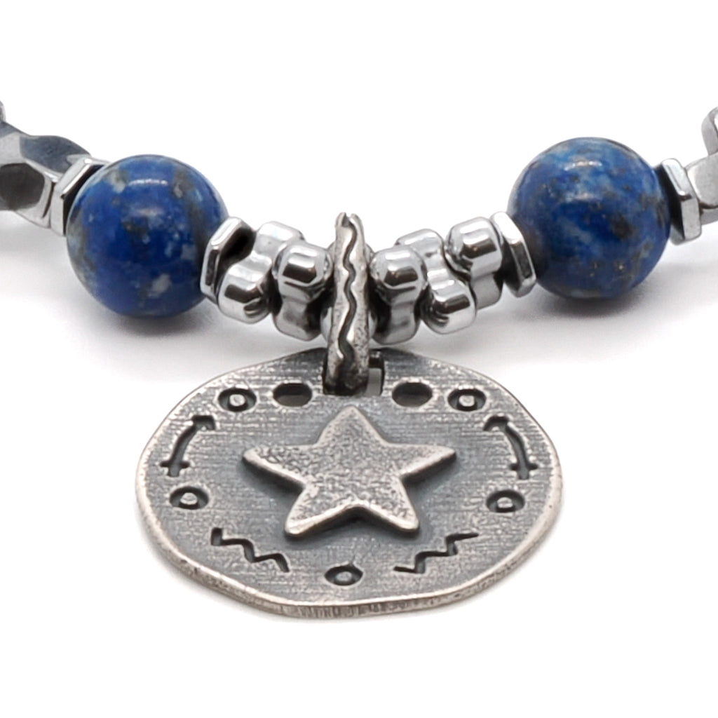 Experience the captivating energy of the Star Blue Lapis Lazuli Bracelet, a handmade accessory that combines the beauty of lapis lazuli with a silver star charm.
