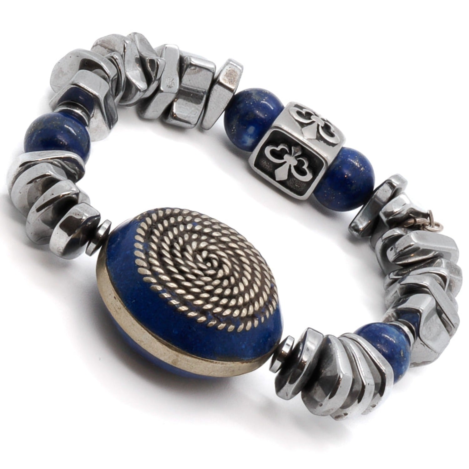 Discover the empowering symbolism of the Strong Women Bracelet, featuring a Nepal silver spiral large bead with lapis lazuli inlay and a Fleur De Li sterling silver bead.