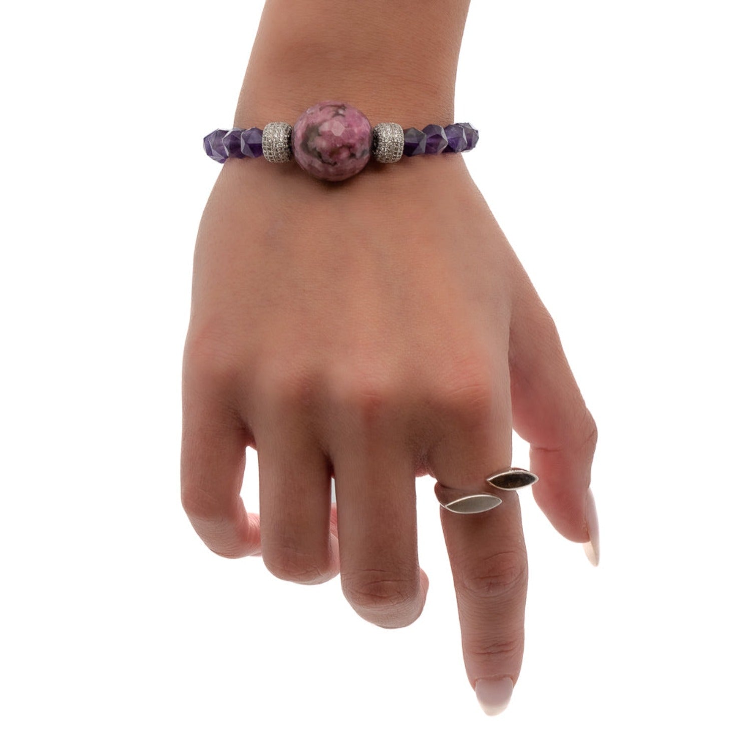Experience the elegance of the Stylish Women Bracelet through the model's graceful presence, highlighting its natural amethyst stones and glamorous design.