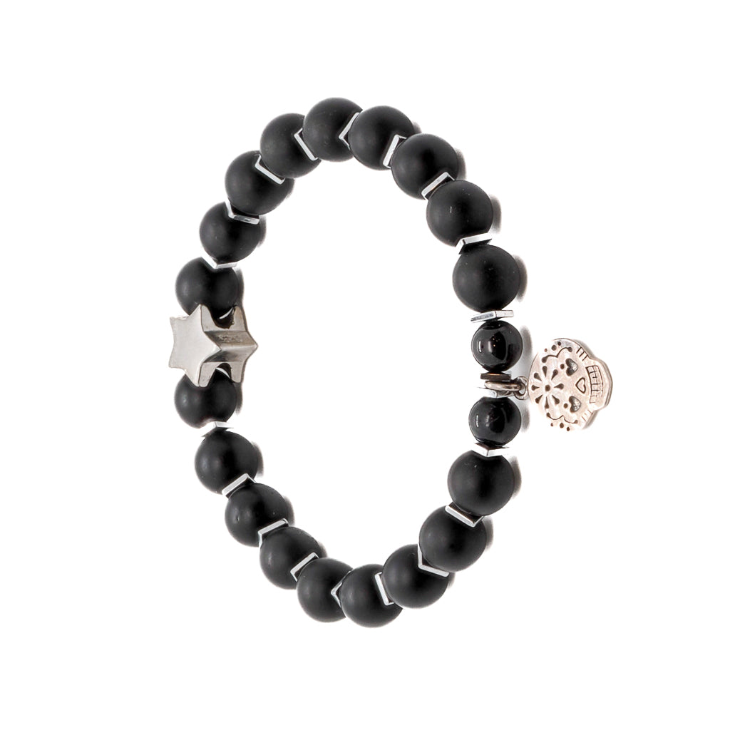 Discover the unique beauty of the Sugar Skull Onyx Bracelet, adorned with Matte black onyx stone beads and a Sterling silver star bead.
