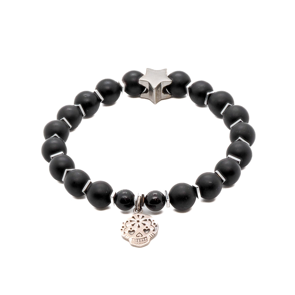 Embrace the edgy and bold style of the Sugar Skull Onyx Bracelet, featuring Matte black onyx stone beads and a striking Sterling silver sugar skull charm.