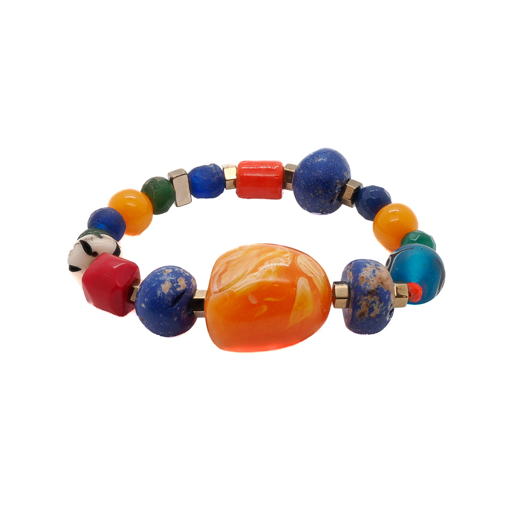 Embrace the vibrant spirit of summer with the captivating Summer Bracelet, handmade with glass beads and striking orange resin beads.