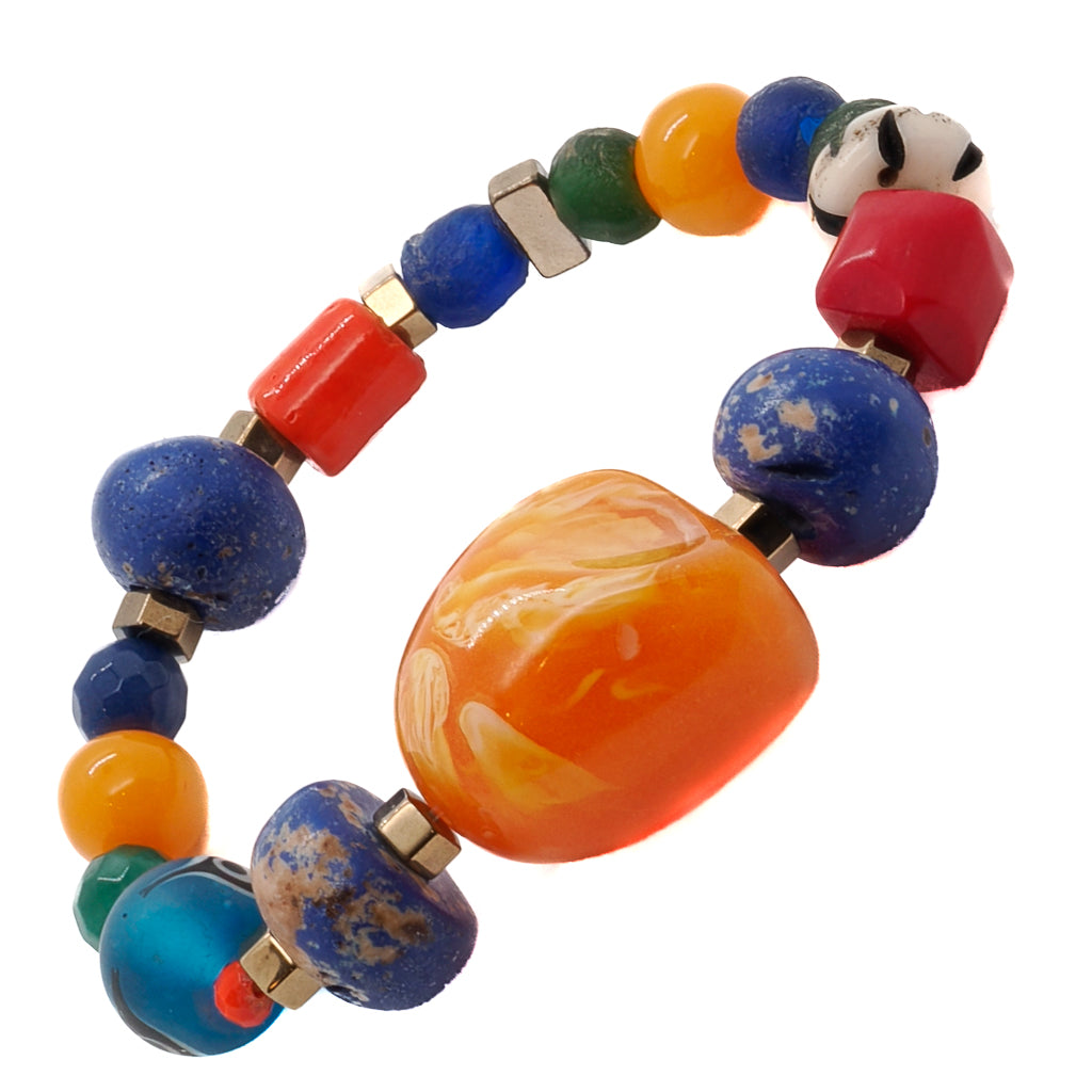 Add a pop of vibrant color to your summer look with the Summer Bracelet, featuring glass beads and striking orange resin beads.