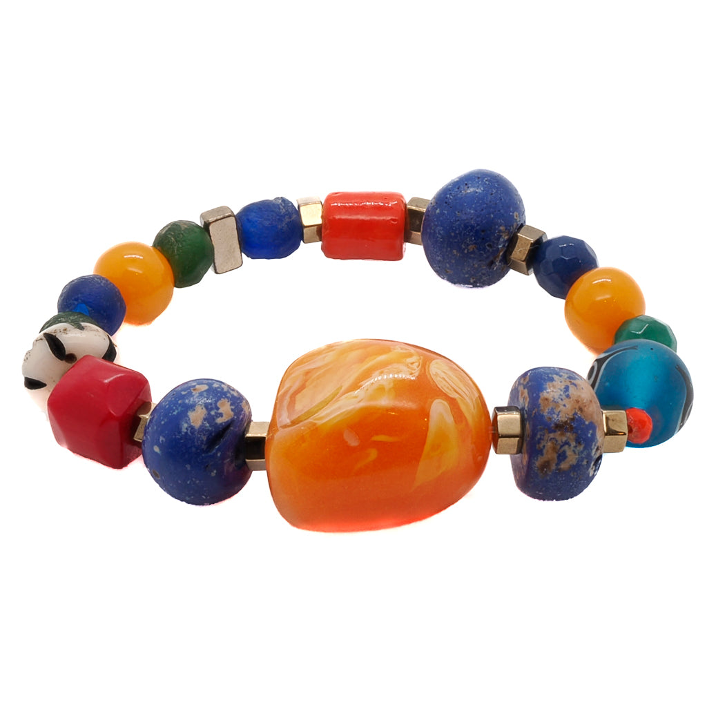 Express your love for summer with the Summer Bracelet, a delightful and handmade accessory featuring glass beads and Nepal blue beads.