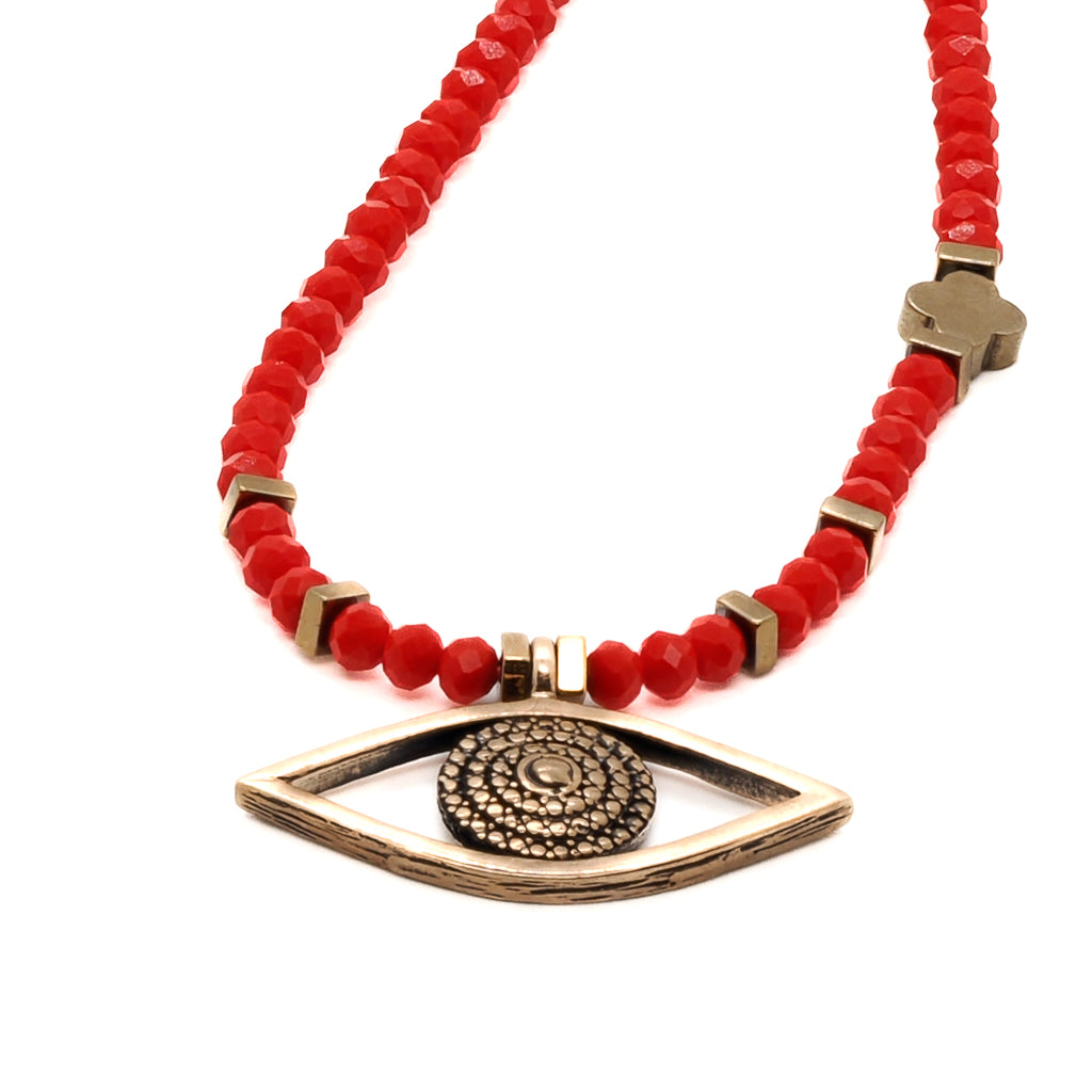 Unique Evil Eye Necklace, a symbol of protection and good luck, in vibrant red.