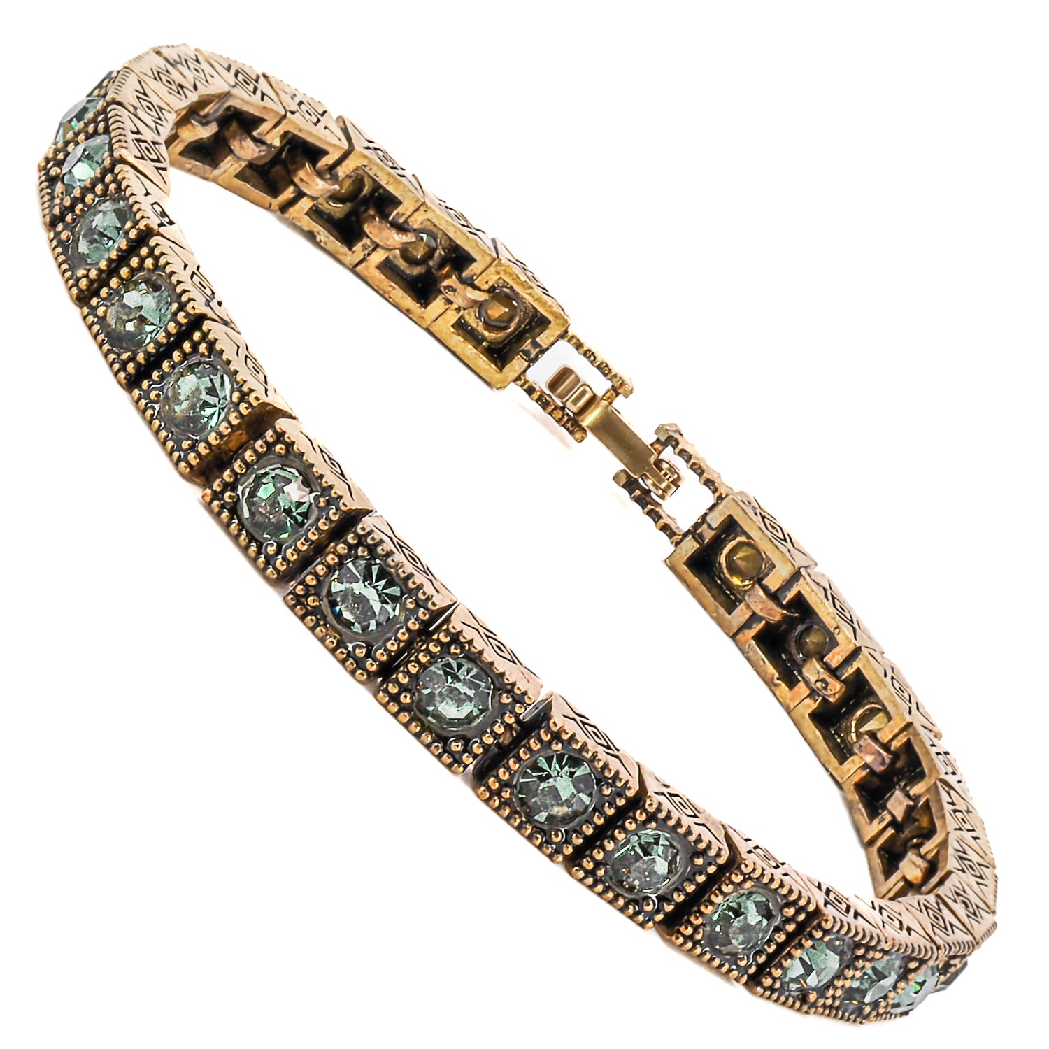 A stunning bronze tennis bracelet adorned with vibrant green Swarovski crystals.