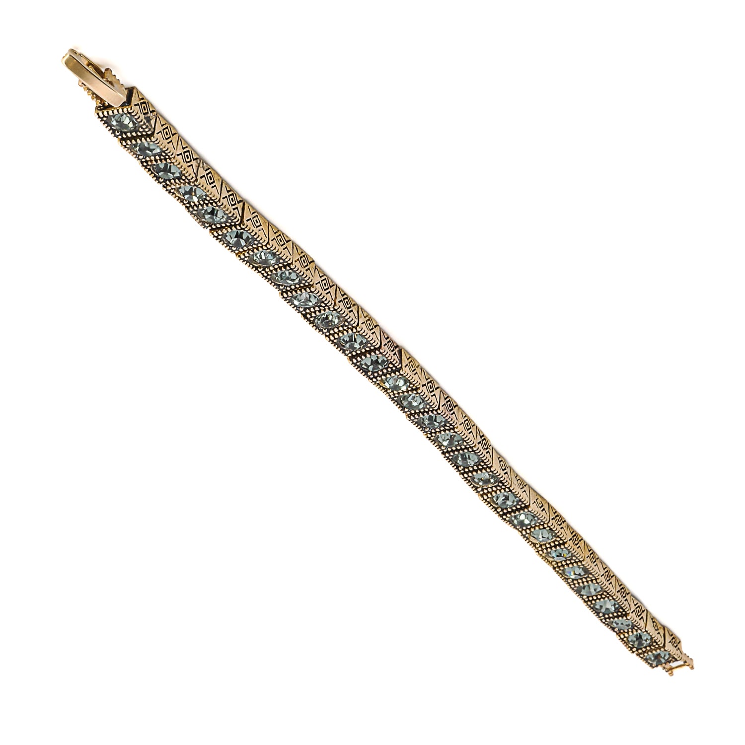 The handcrafted Tennis Bracelet showcasing its unique combination of bronze and green crystals.