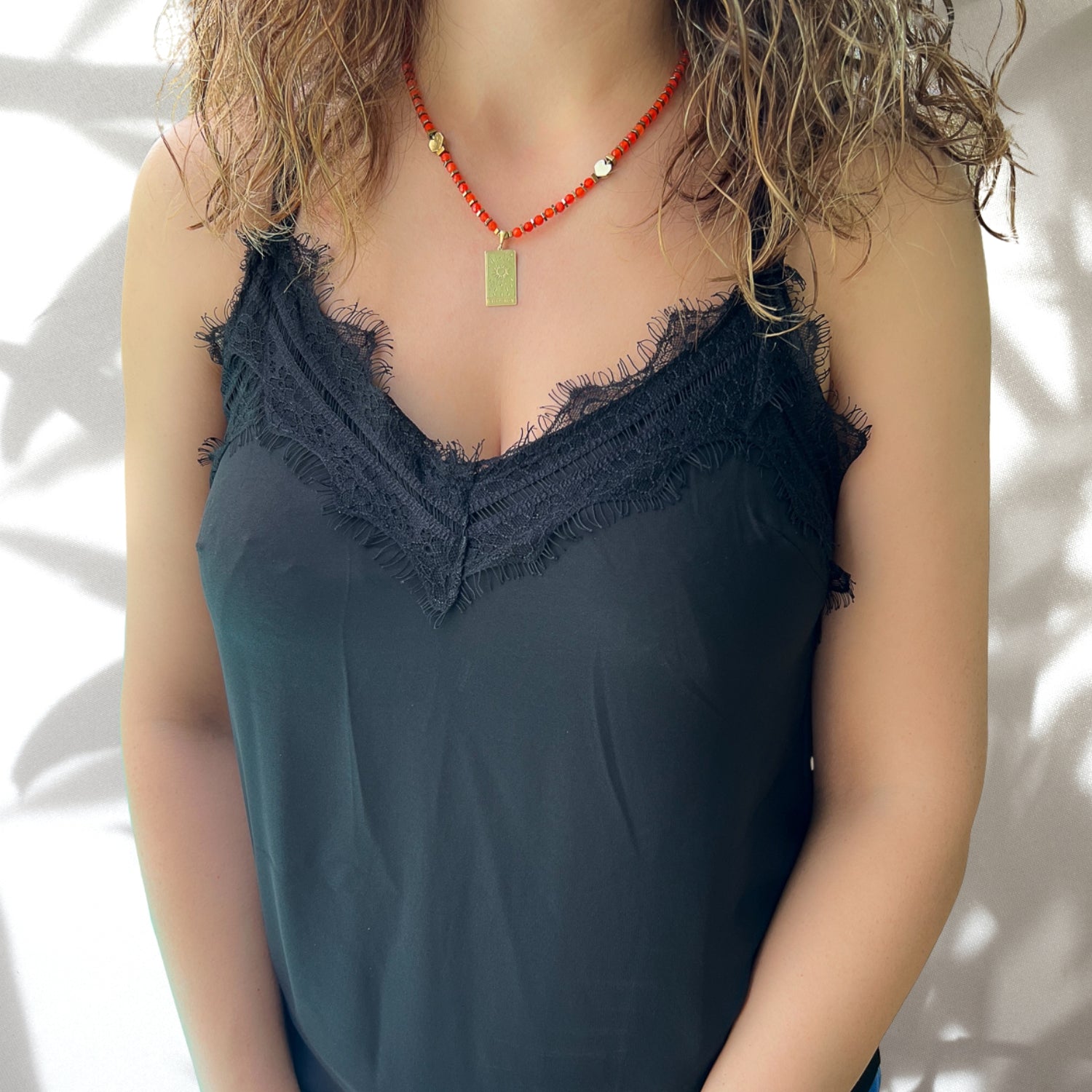 Model Wearing Gold Agate Sun Tarot Necklace: Radiating style and positive energy