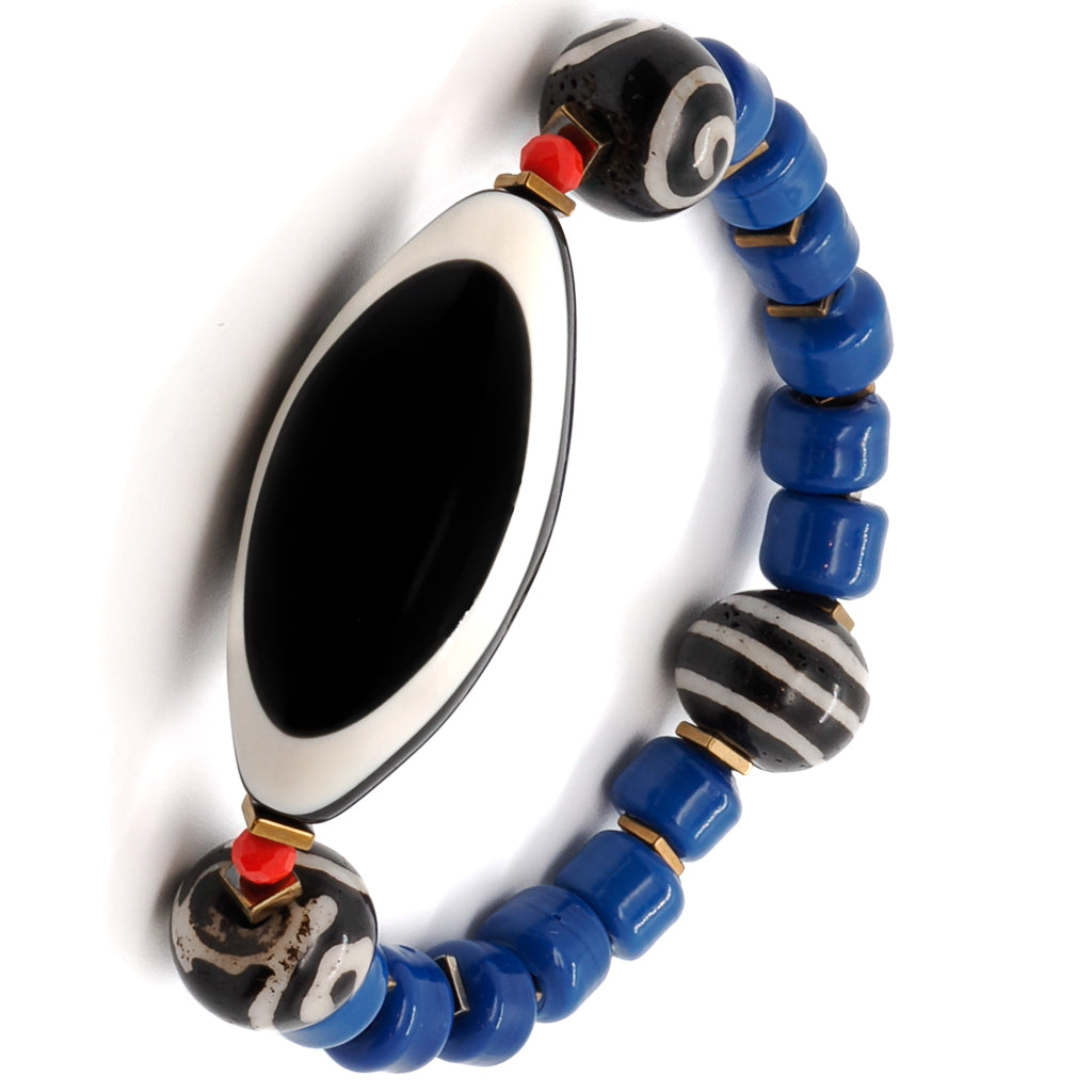 Experience the positive vibes and style of the Third Eye Tibetan Bracelet, adorned with eye beads and carefully crafted details.