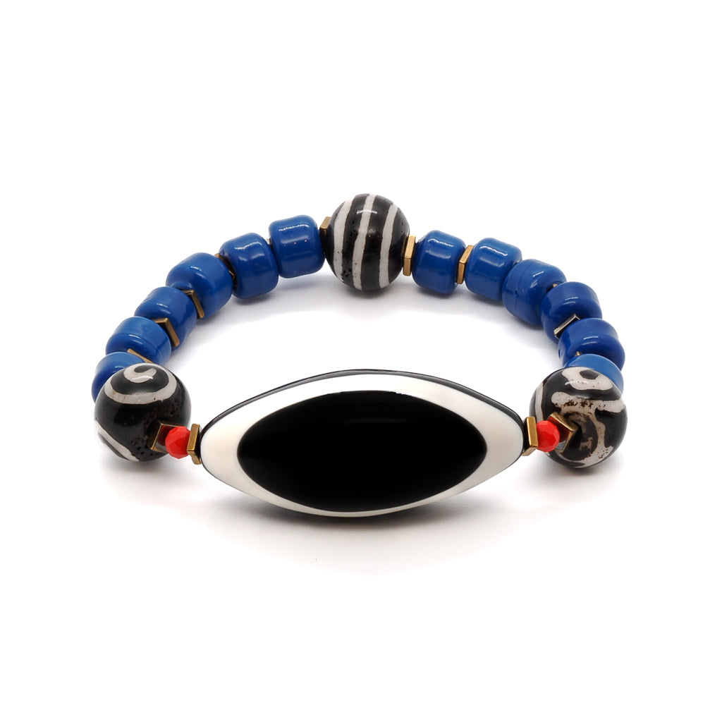 Embrace style and protection with the Third Eye Tibetan Bracelet, featuring vibrant blue Indian beads and a big eye resin bead.