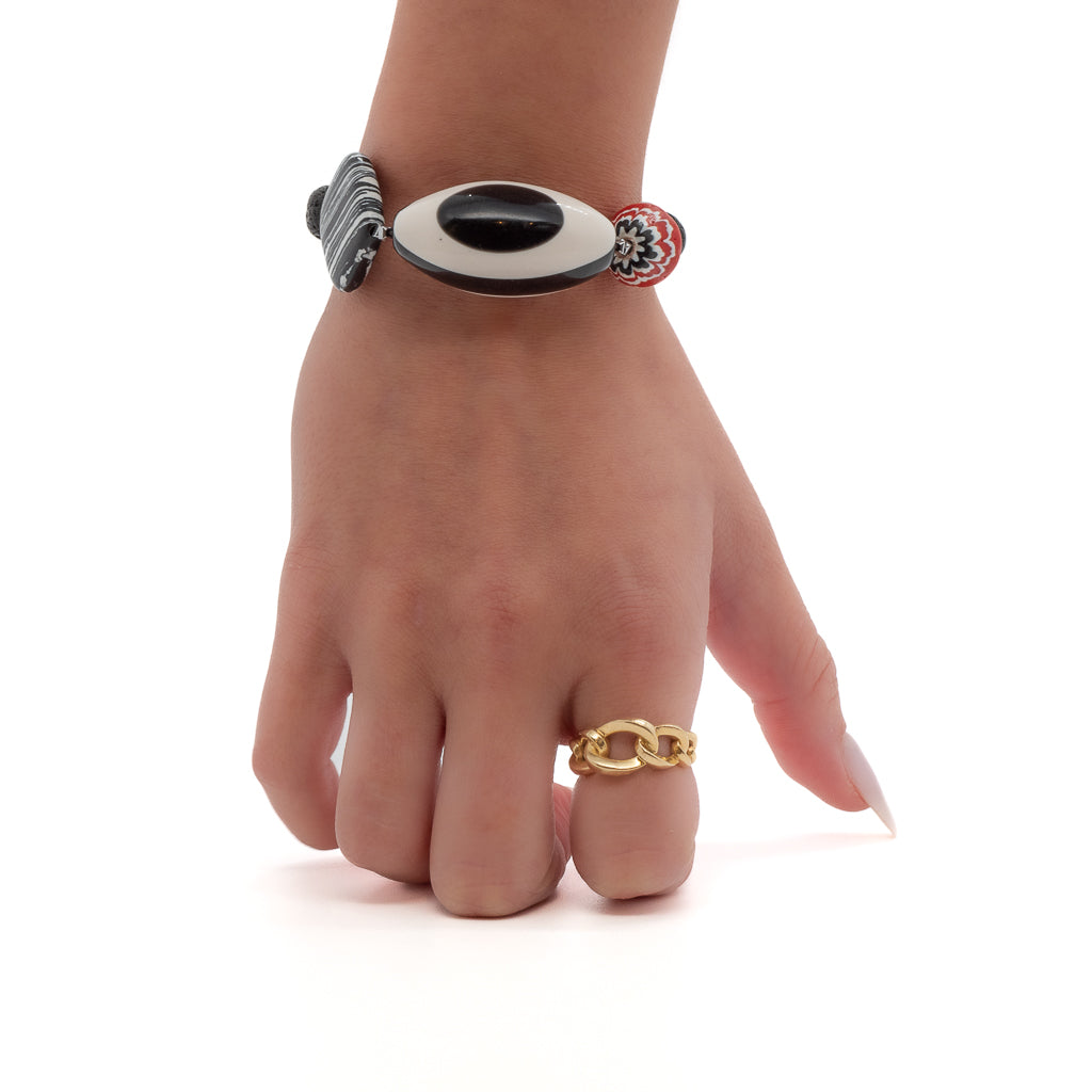 See how the Third Eye Bracelet adds a touch of style and protection to the model&#39;s ensemble,