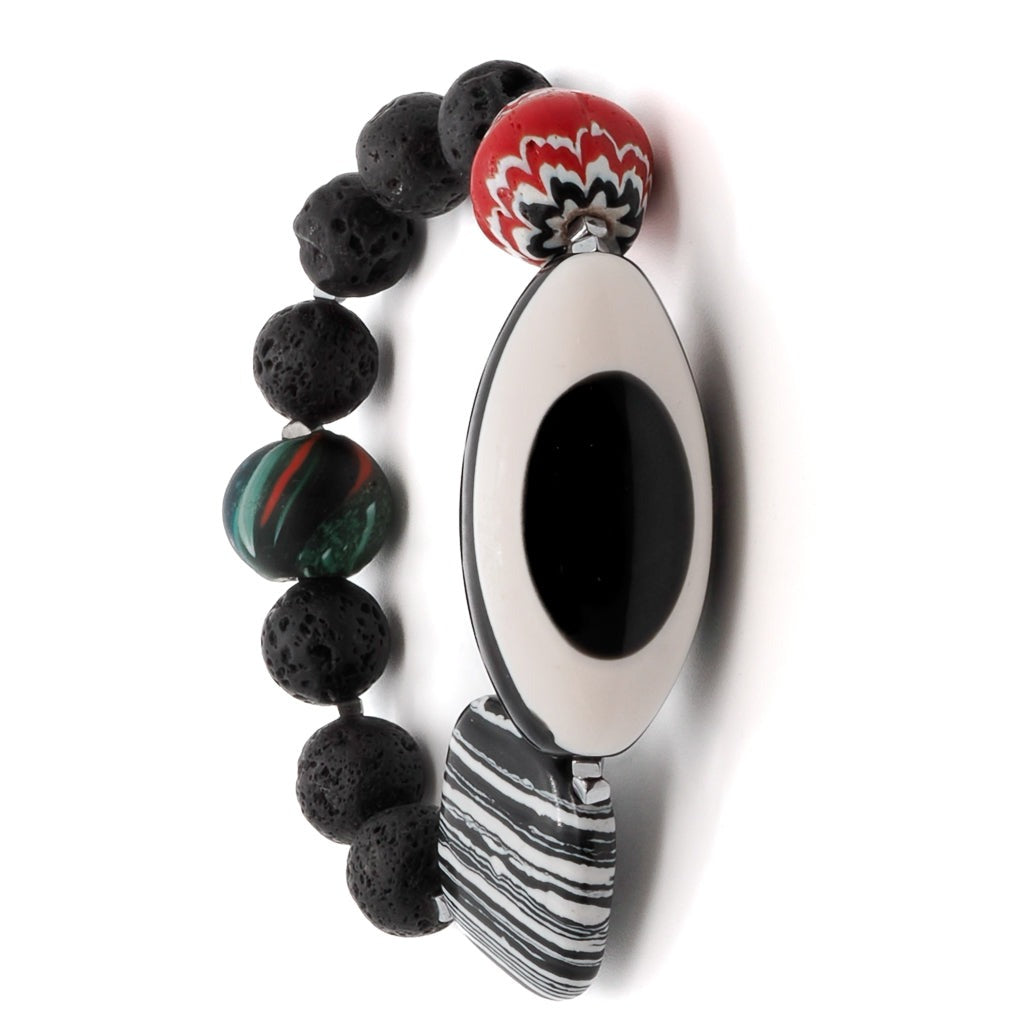Elevate your style with the Third Eye Bracelet, a handmade piece that combines vibrant red Nepal beads with the powerful symbolism of the eye resin centerpiece.