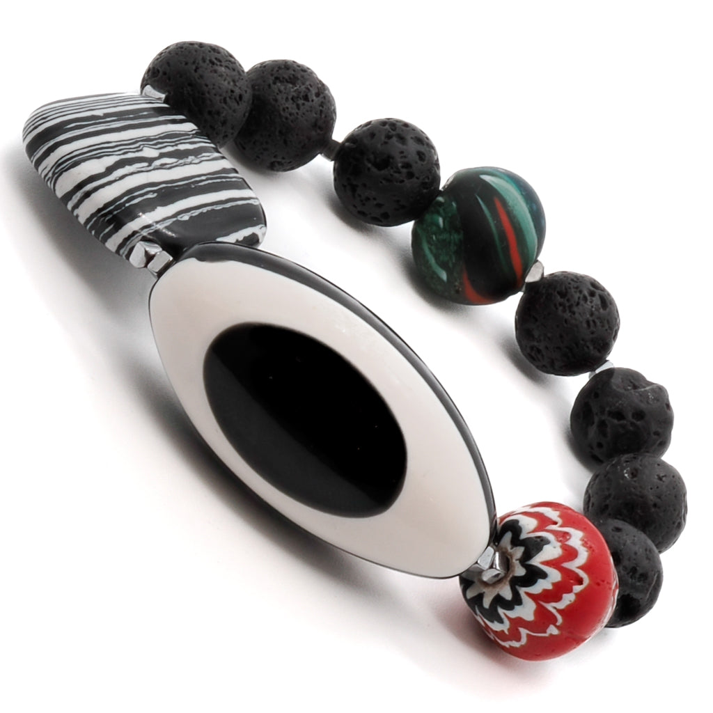 Experience the style and protection of the Third Eye Bracelet, featuring black lava rock beads, silver hematite spacers, and a bold eye resin bead.