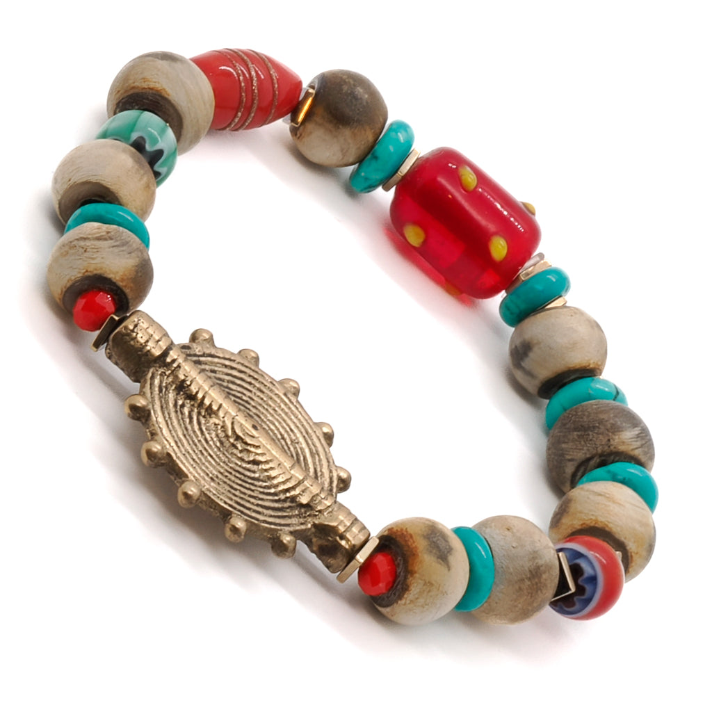 Admire the vibrant colors of the Tibetan Ethnic Bracelet, showcasing its stunning red and yellow Mystic glass bead.