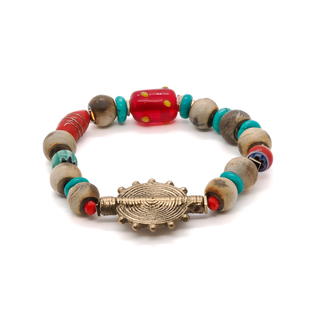 Explore the beauty of the Tibetan Ethnic Bracelet, featuring Nepal seed beads and a captivating turquoise stone.