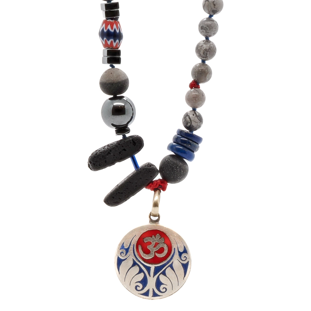 Experience the beauty and spirituality of the Tibetan Om Necklace, crafted with intricate details and a stunning combination of stones.