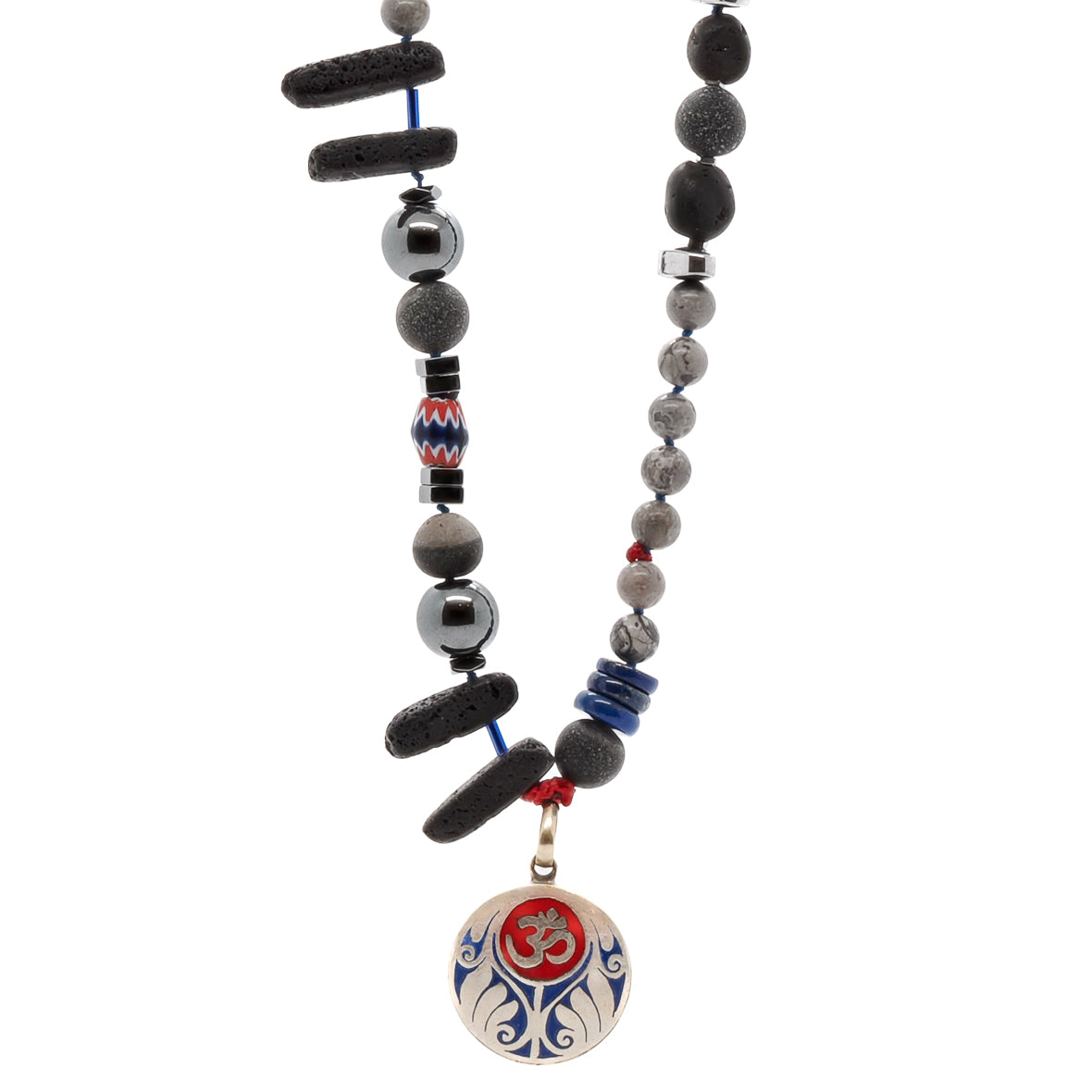 The Tibetan Om Necklace is a stunning piece of jewelry that combines various natural materials to create a unique and stylish accessory.