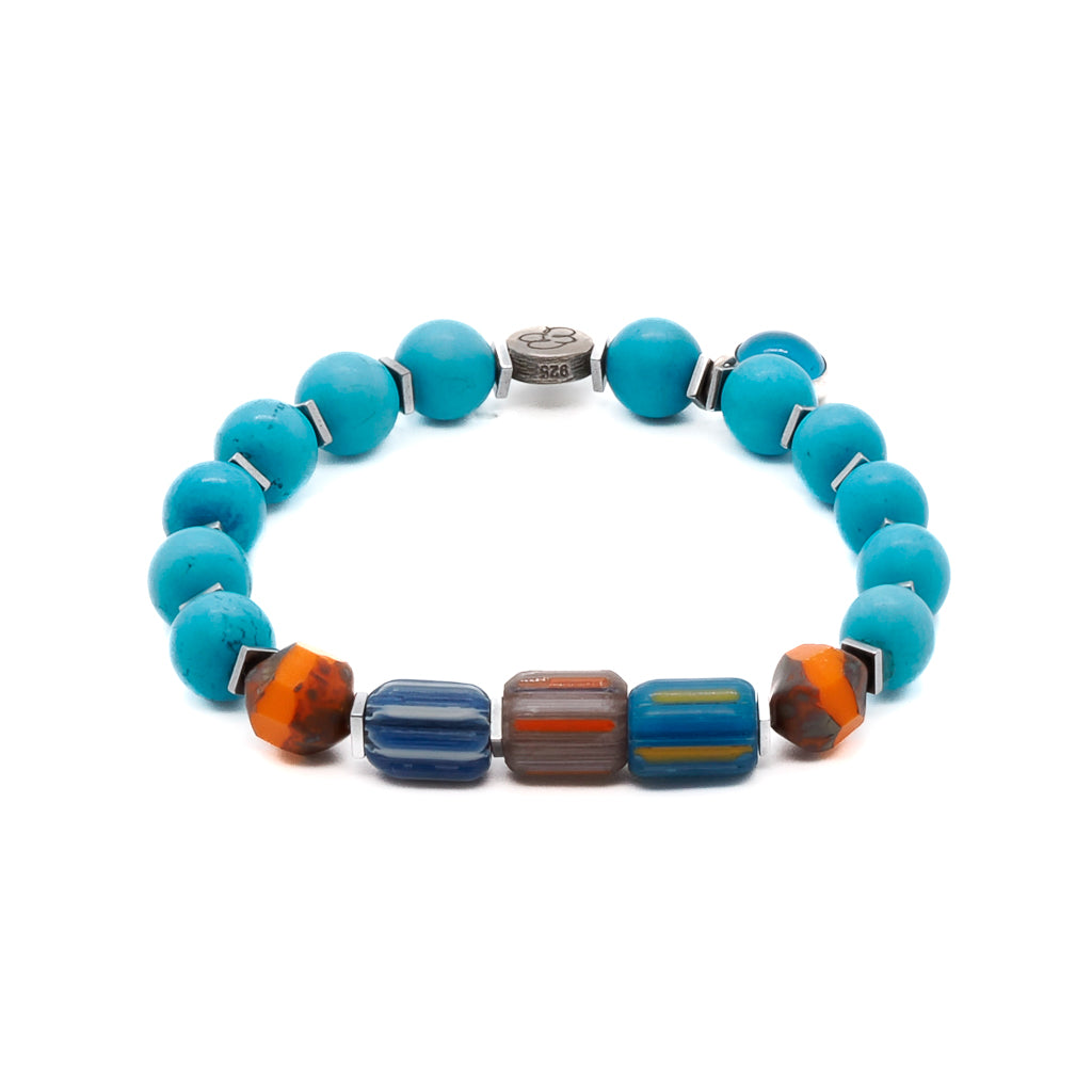 Embrace the tropical vibes with the Tropical Vibes Evil Eye Bracelet, featuring turquoise stone beads, colorful African beads, and a 925 silver evil eye bead.