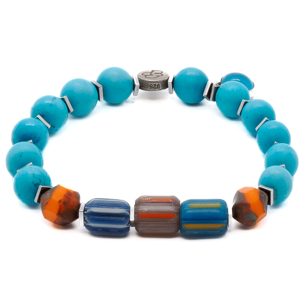 Experience the tropical paradise with the Tropical Vibes Evil Eye Bracelet, adorned with turquoise stone beads, African beads, and a glass evil eye bead.