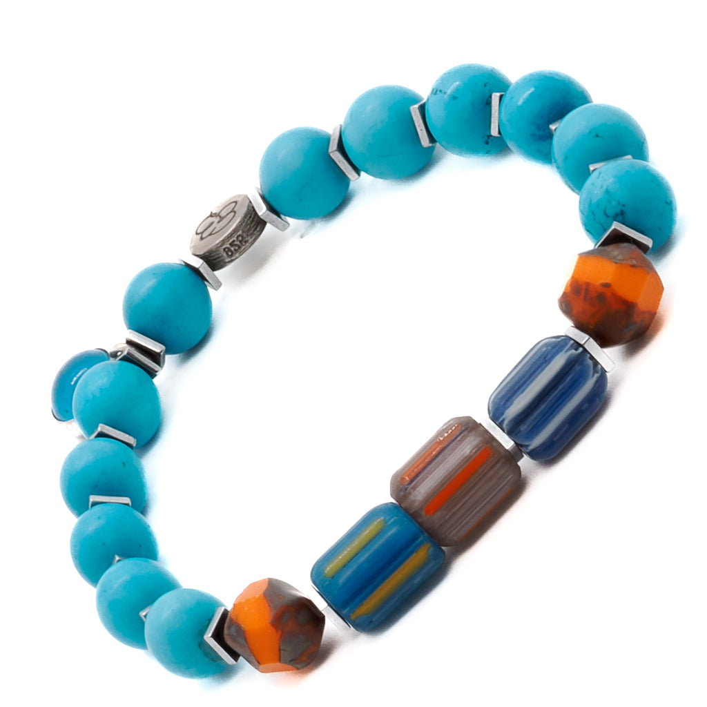 Elevate your style with the Tropical Vibes Evil Eye Bracelet, featuring vibrant turquoise stone beads, African beads, and a glass evil eye bead.