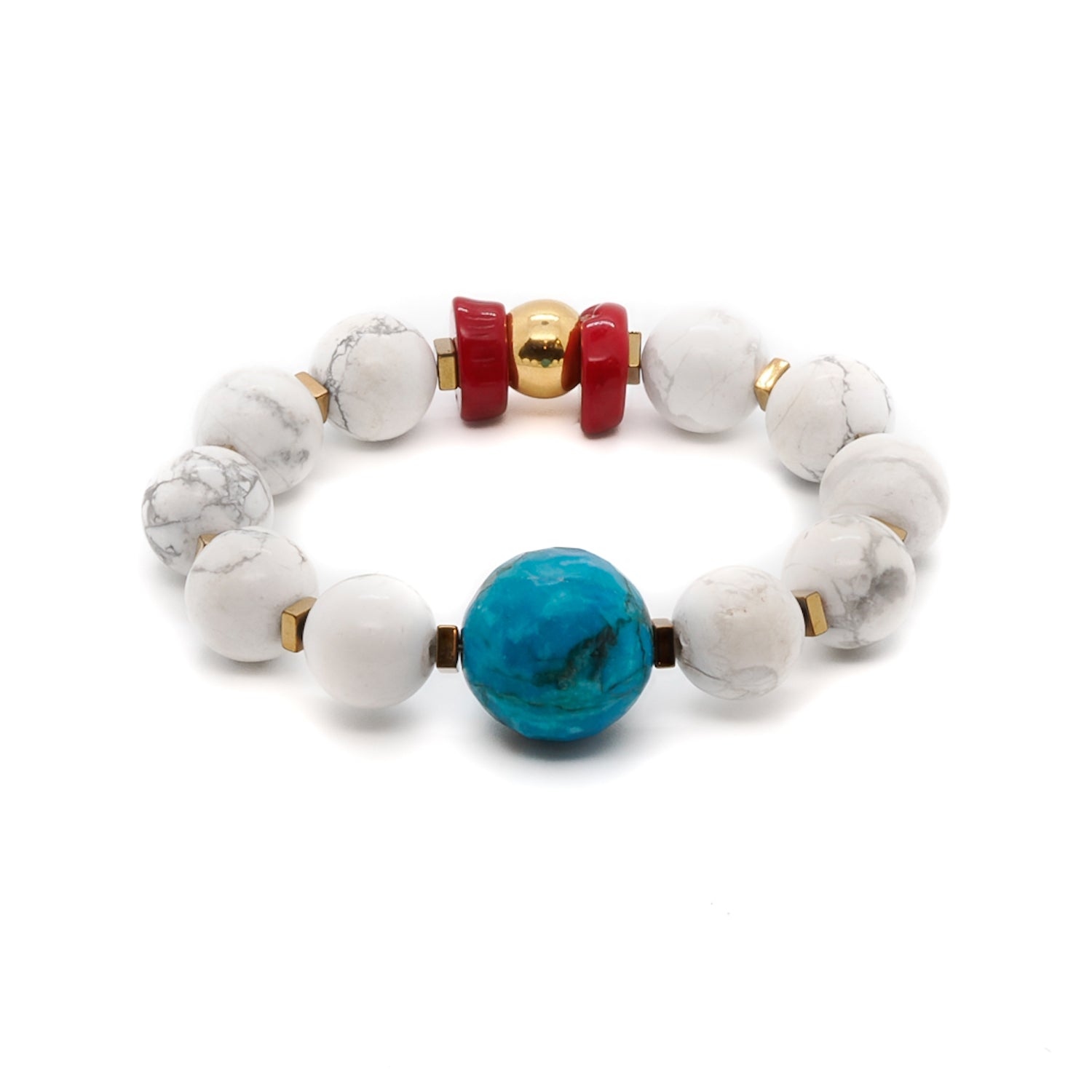 Add a touch of elegance to your style with the Turquoise Balance Bracelet, featuring turquoise, howlite, and red coral stone beads.