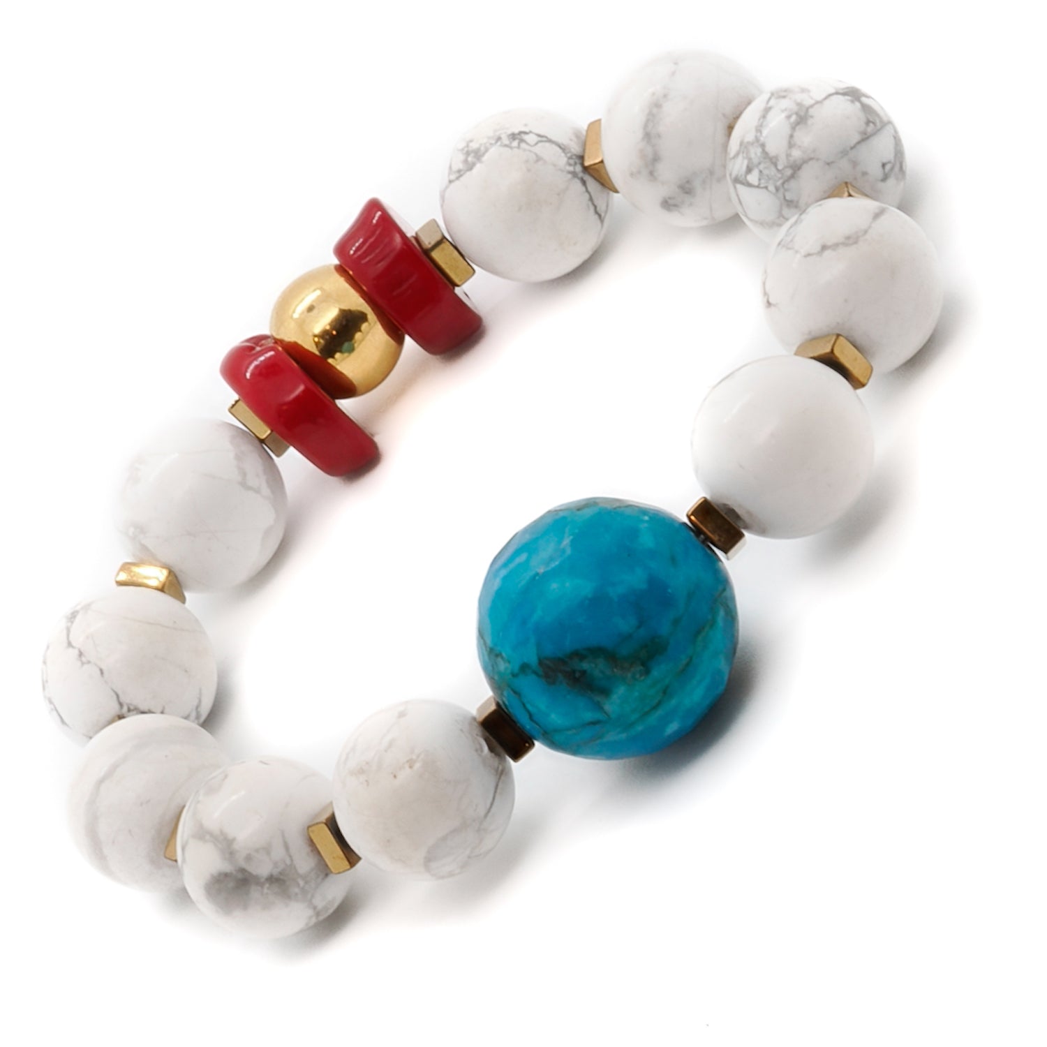 Achieve inner calm and balance with the Turquoise Balance Bracelet, crafted with turquoise, howlite, and red coral stones.